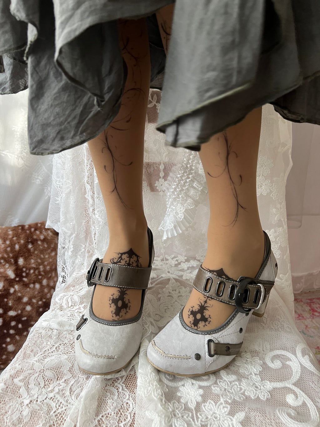 White Mustang heels with gray straps and buckles
