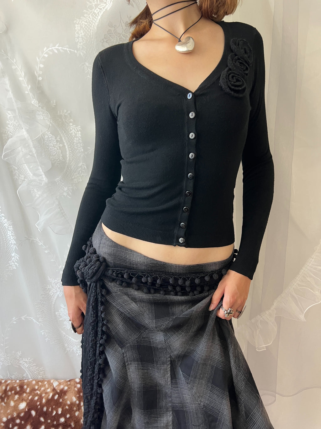 Black long sleeve top with button up front and flower detail
