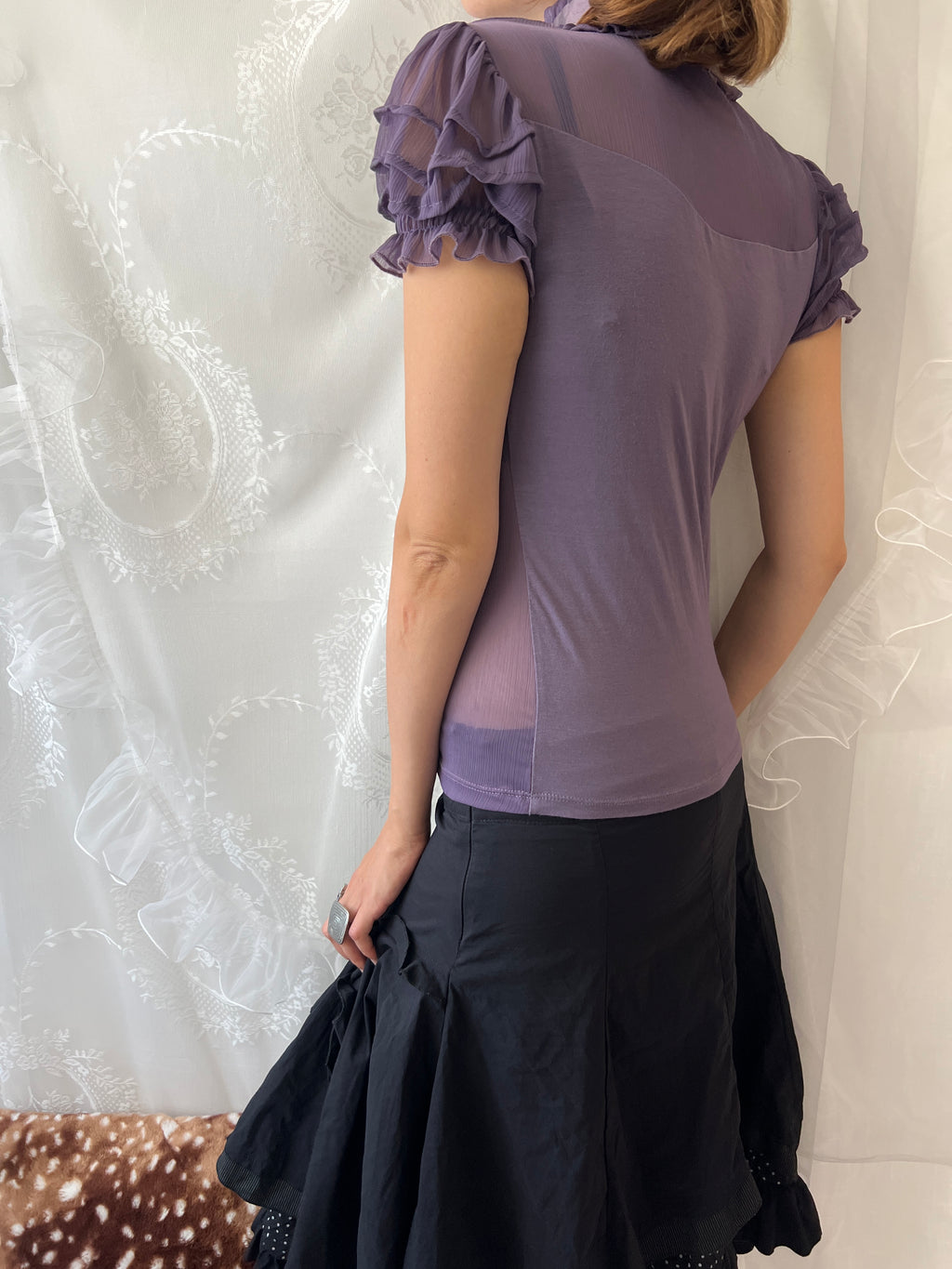 Purple sheer blouse with ruffles and lace details