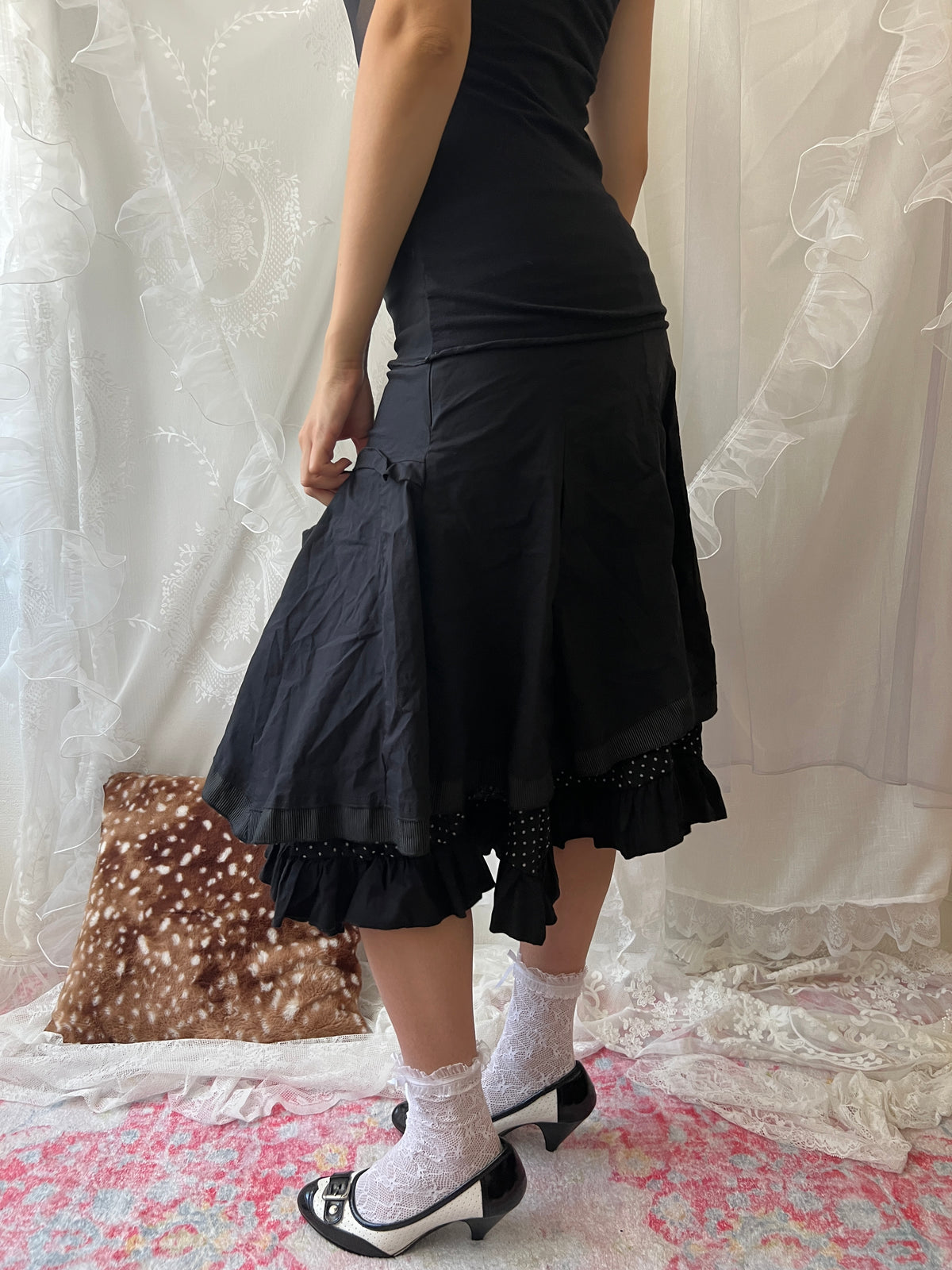 Black layered midi skirt with ruffles and polka dots
