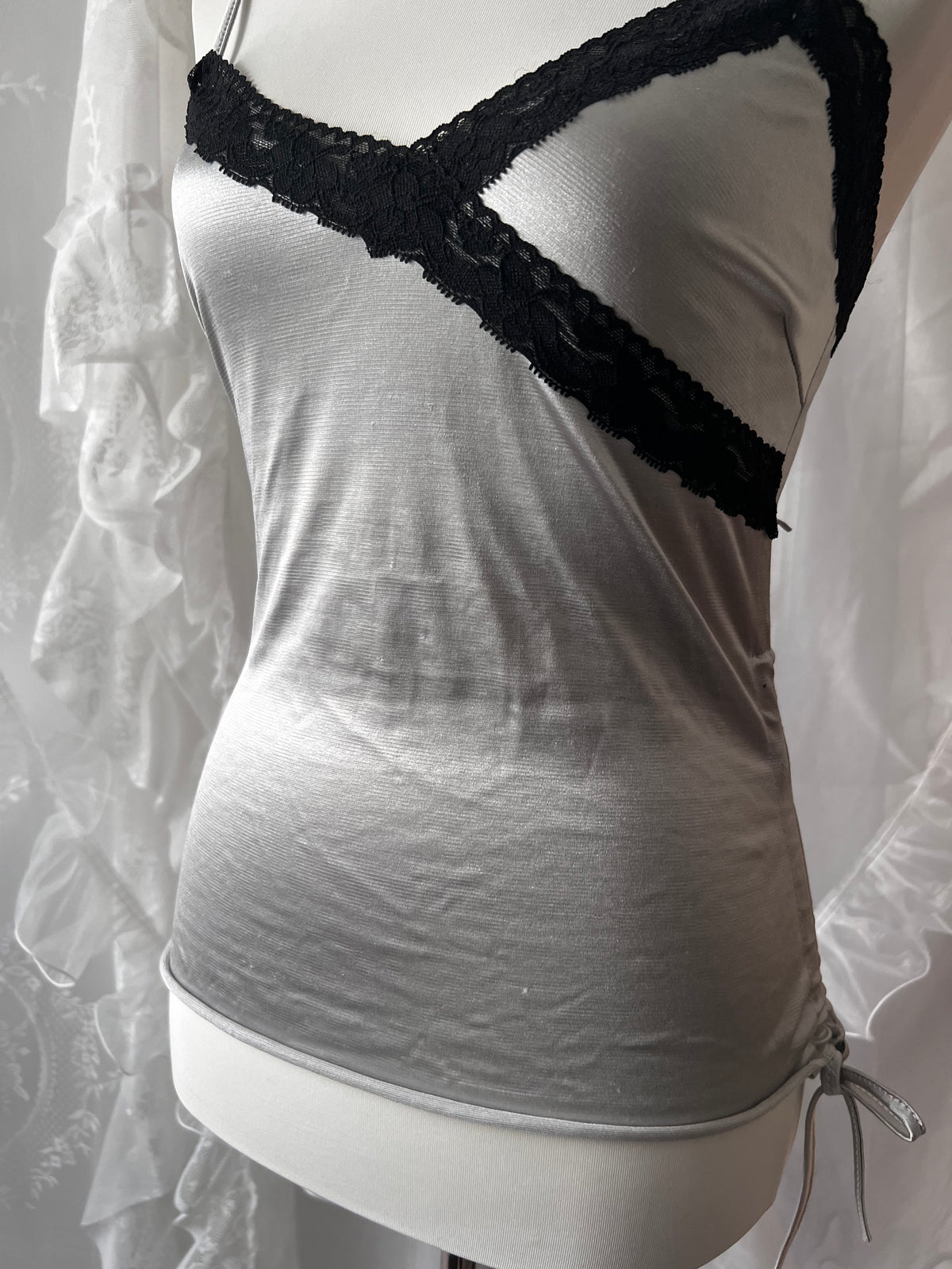 Black lace silver cami top with adjustable straps and tie detail