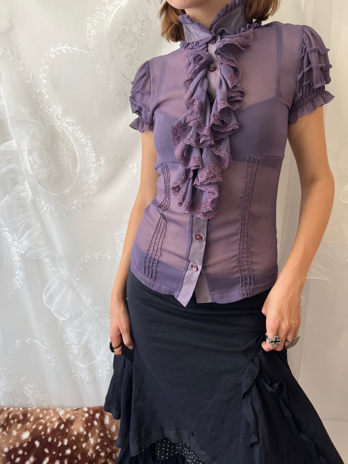 Purple sheer blouse with ruffles and lace details