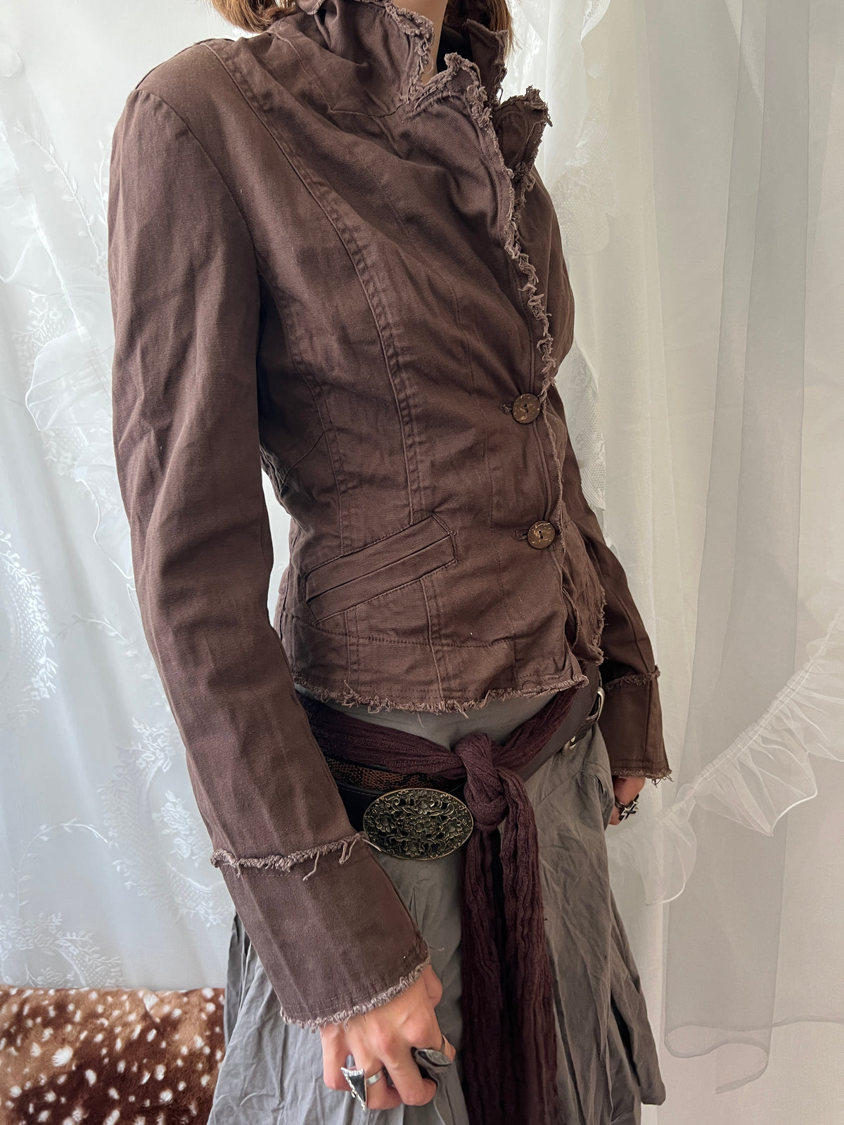 Brown cropped jacket with frayed hem and button details