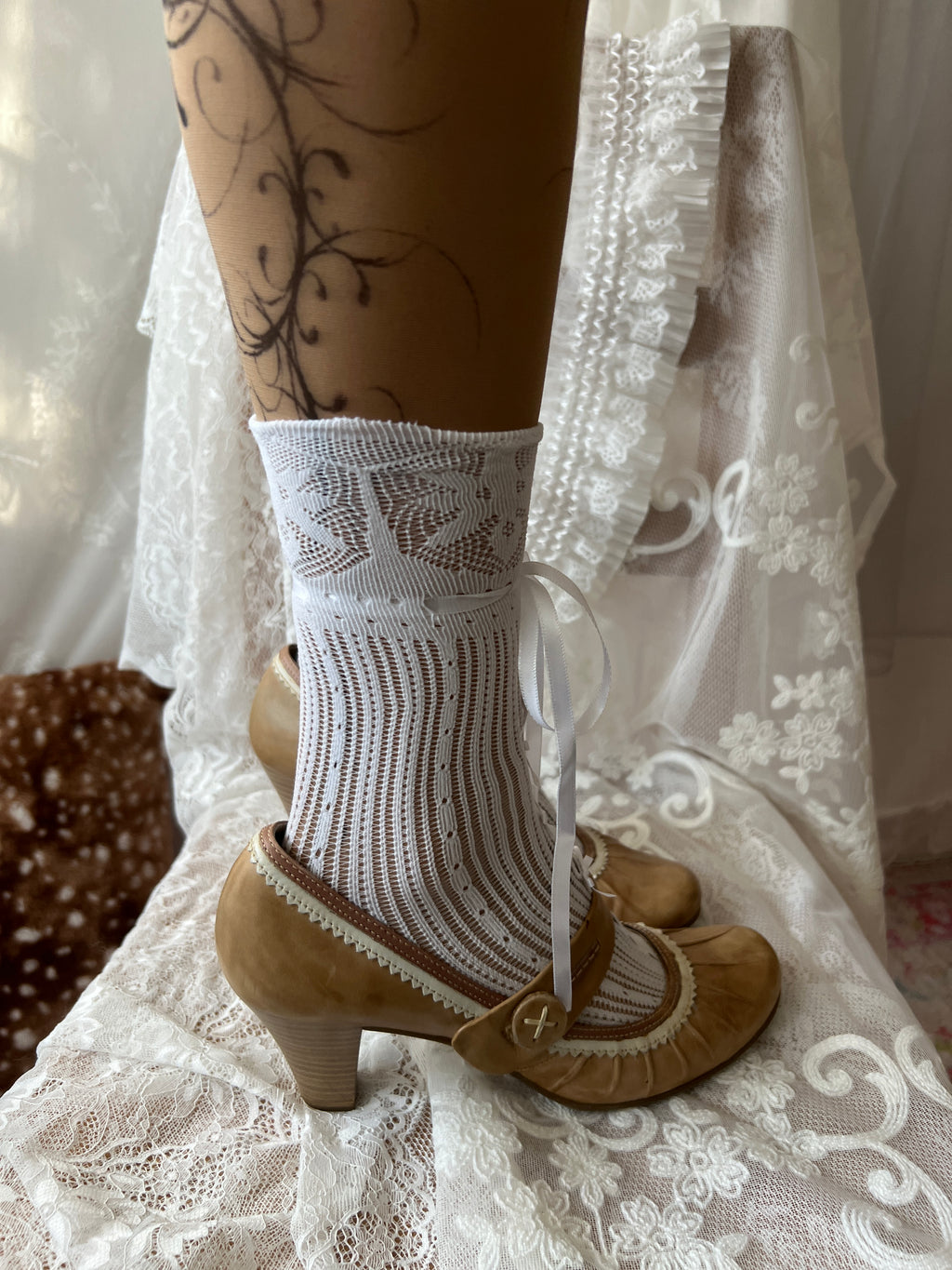 Tan Mary Jane heels with white lace trim and button detail