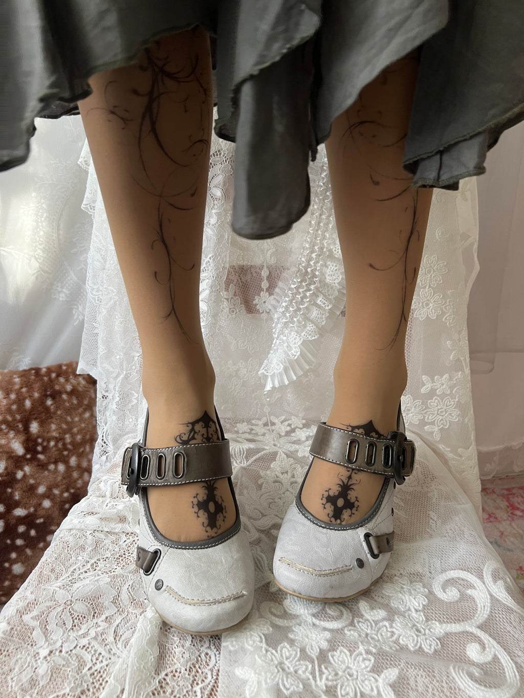 White Mustang heels with gray straps and buckles