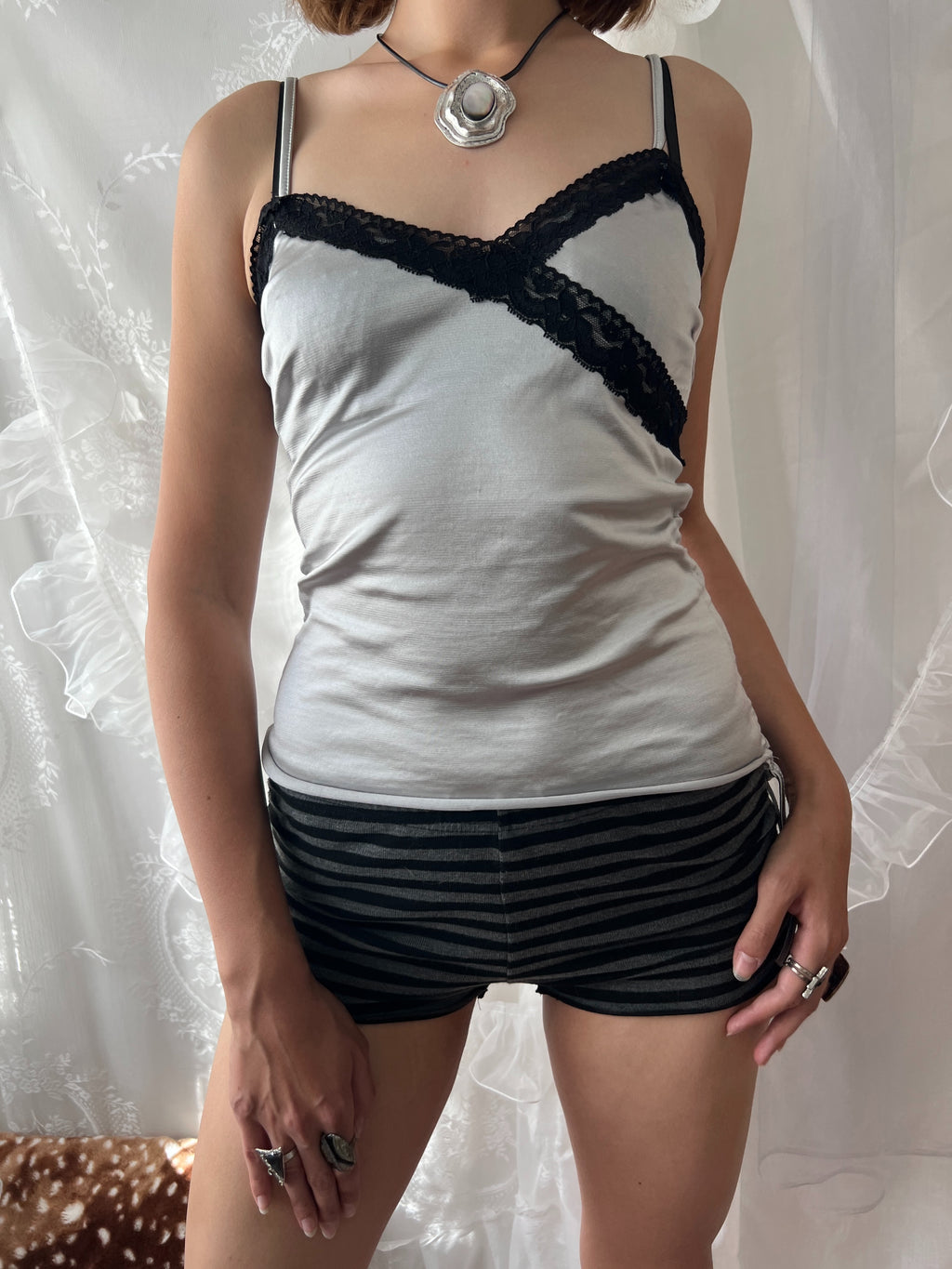 Black lace silver cami top with adjustable straps and tie detail