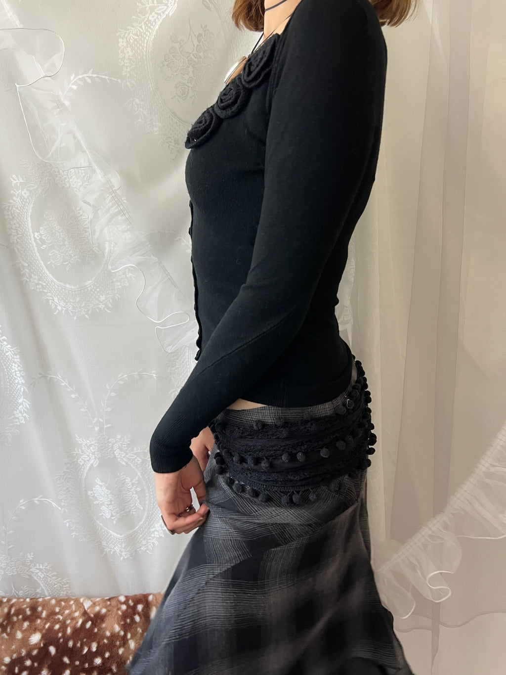 Black long sleeve top with button up front and flower detail