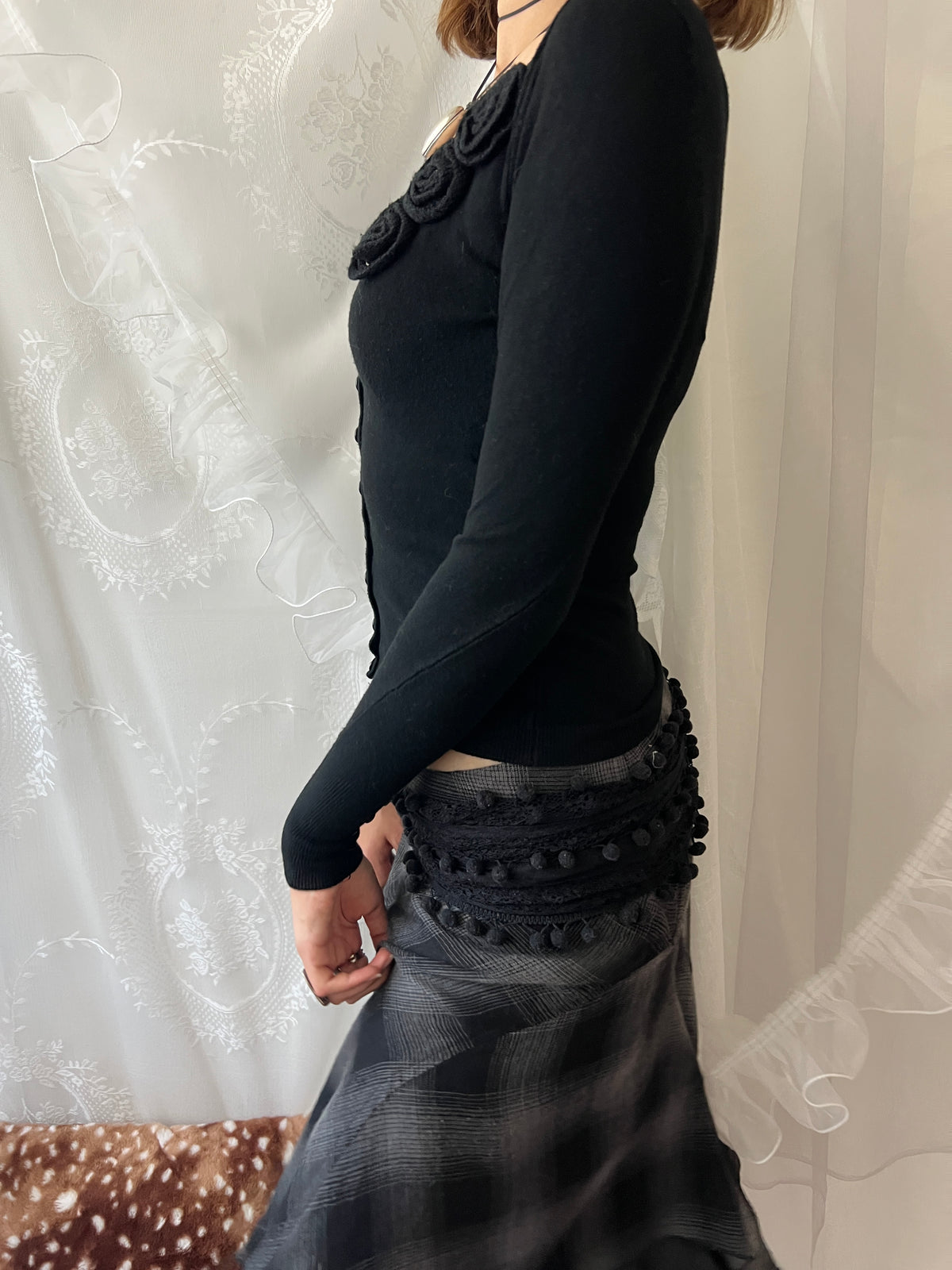 Black long sleeve top with button up front and flower detail