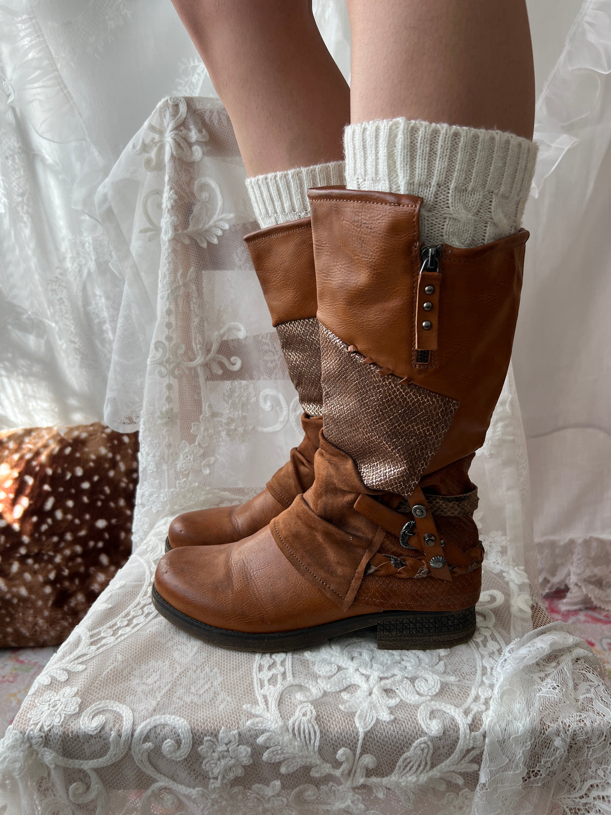 Brown boots with snake skin pattern
