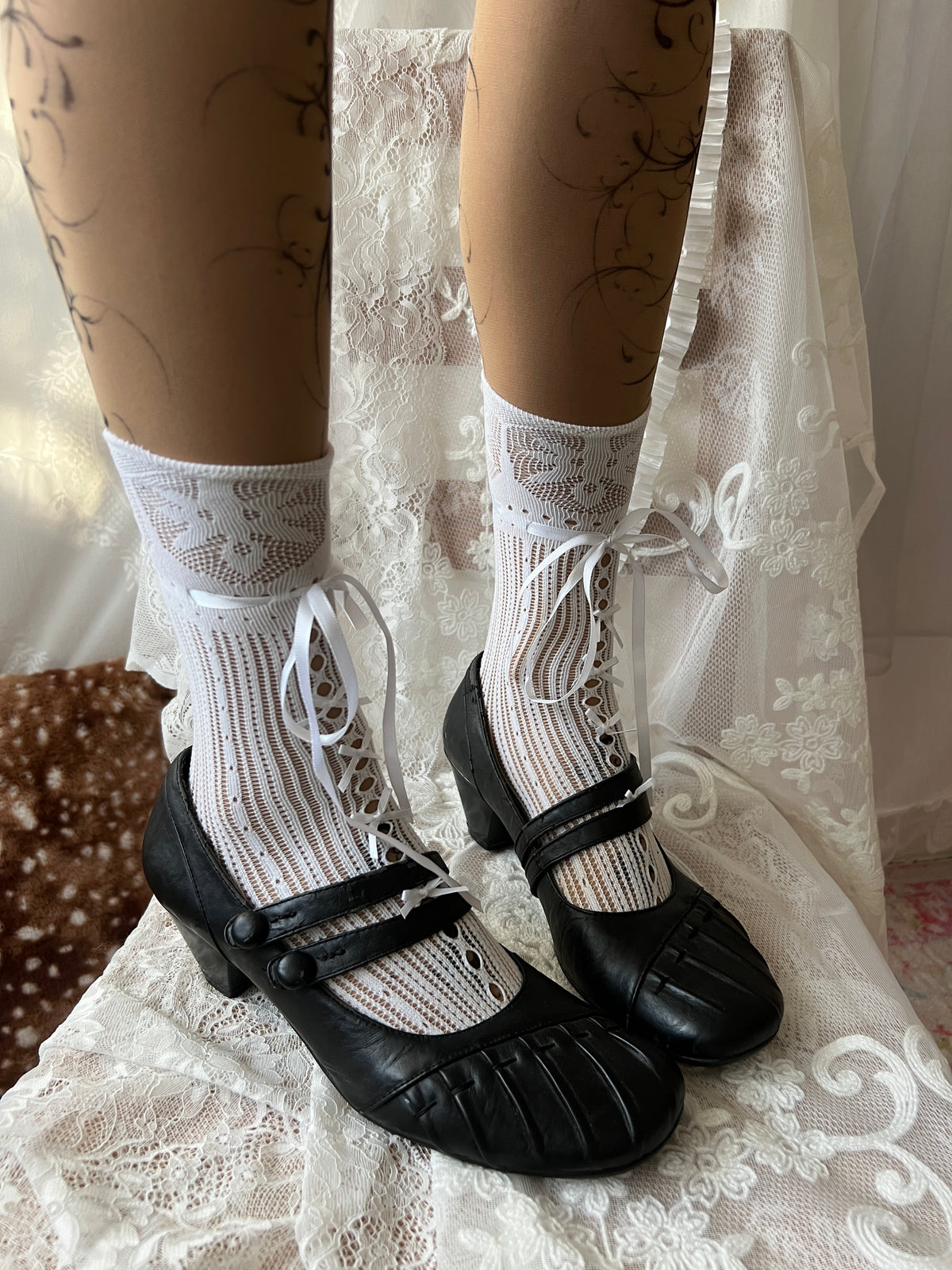 Black Mary Jane shoes with button detail