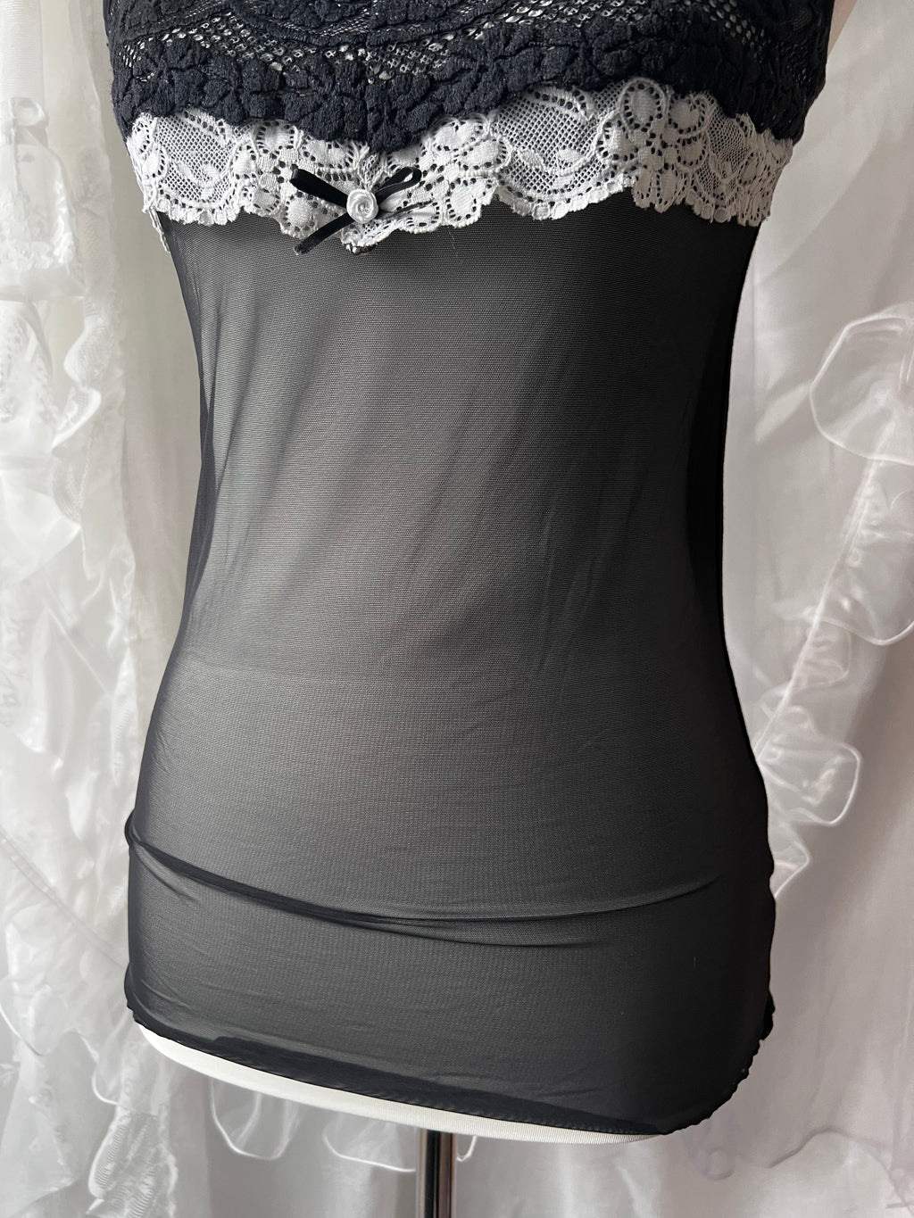 Black lace cami top with white lace trim and bow detail