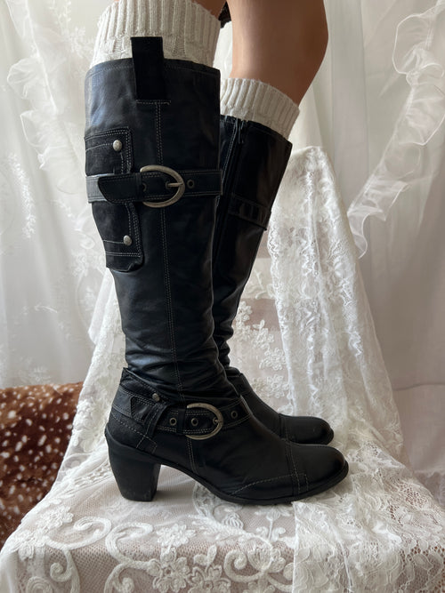 Black knee high boots with silver buckles