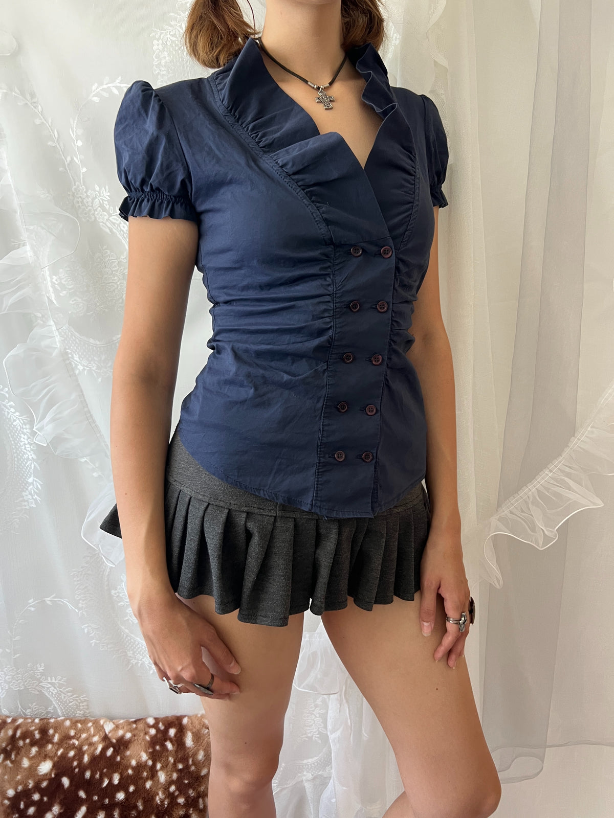 Navy blue button up blouse with ruffle details