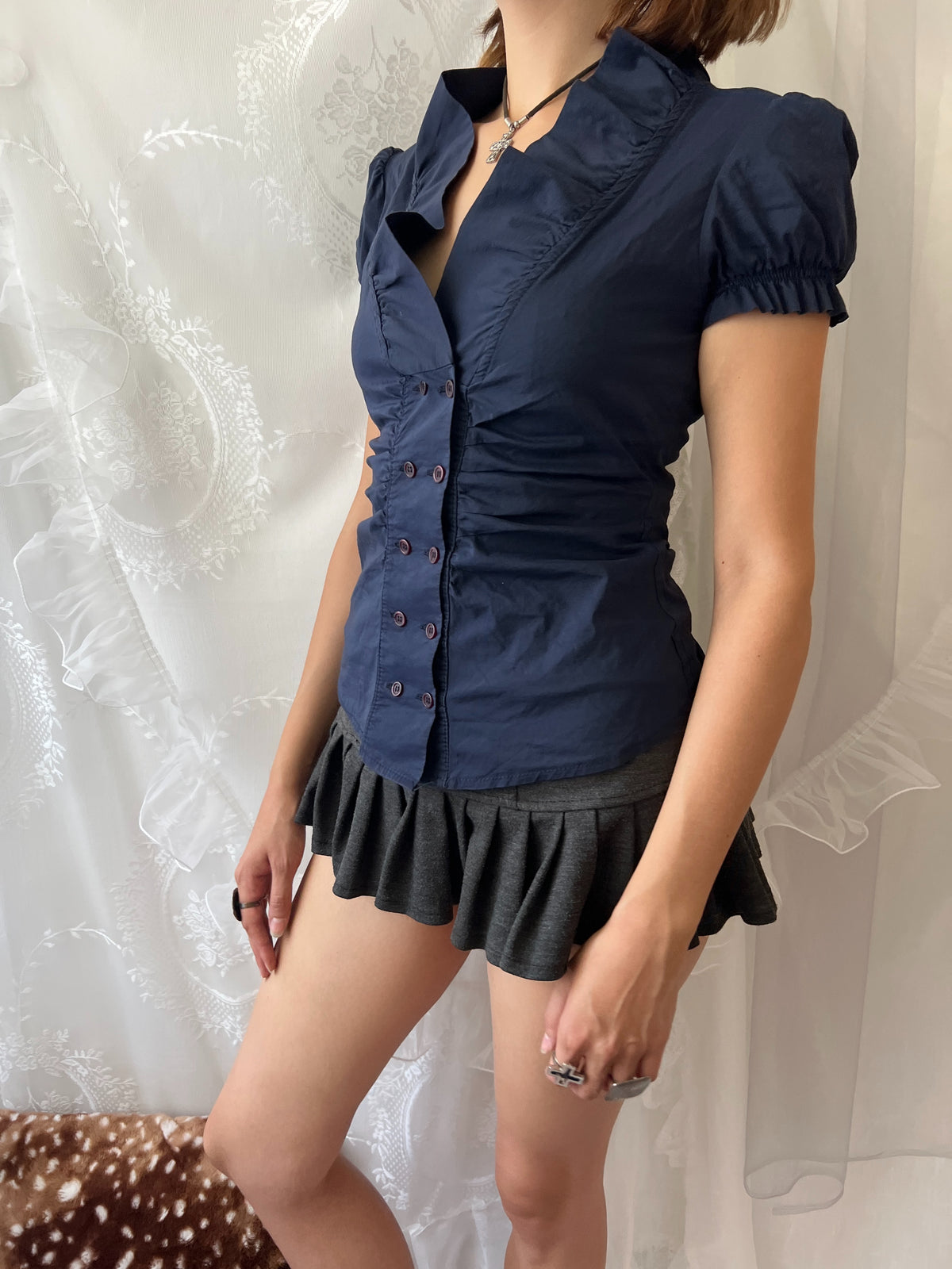 Navy blue button up blouse with ruffle details