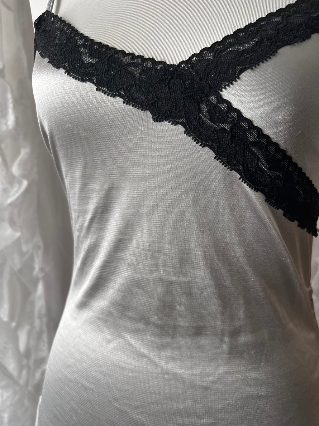 Black lace silver cami top with adjustable straps and tie detail