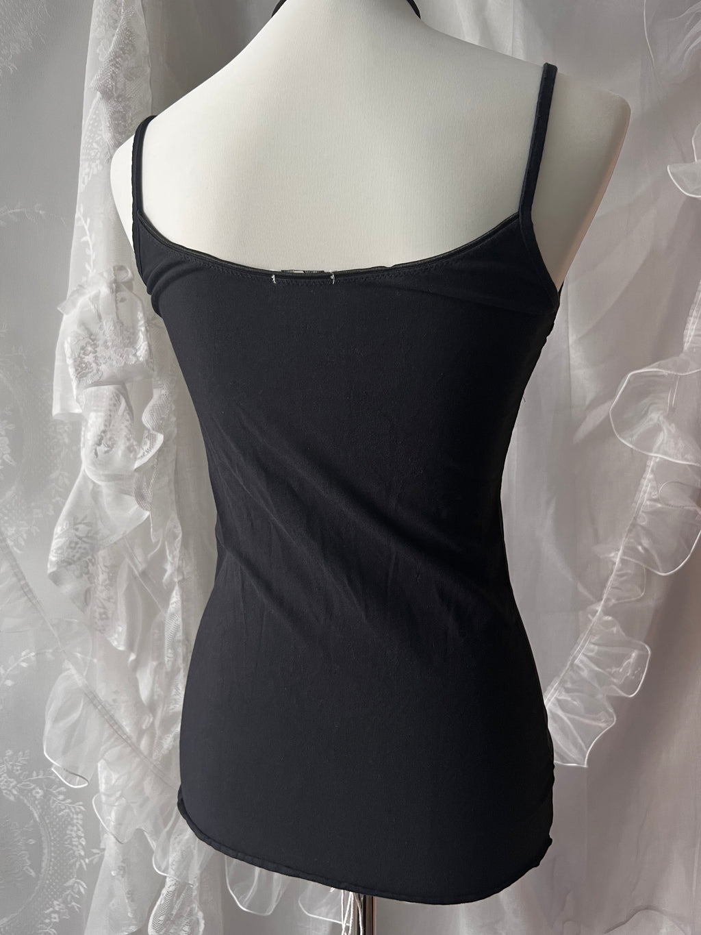 Black lace cami top with white lace trim and bow detail