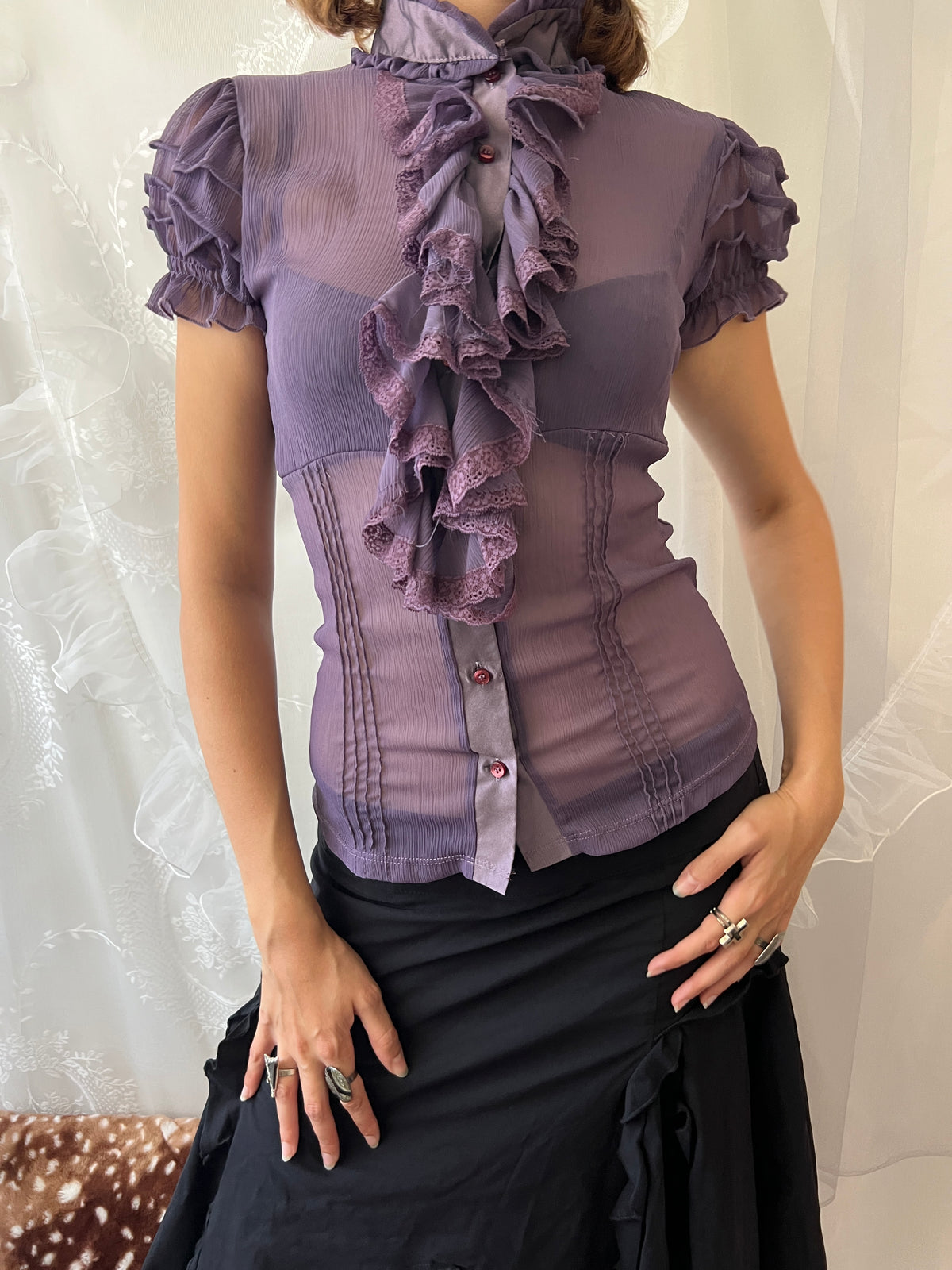 Purple sheer blouse with ruffles and lace details
