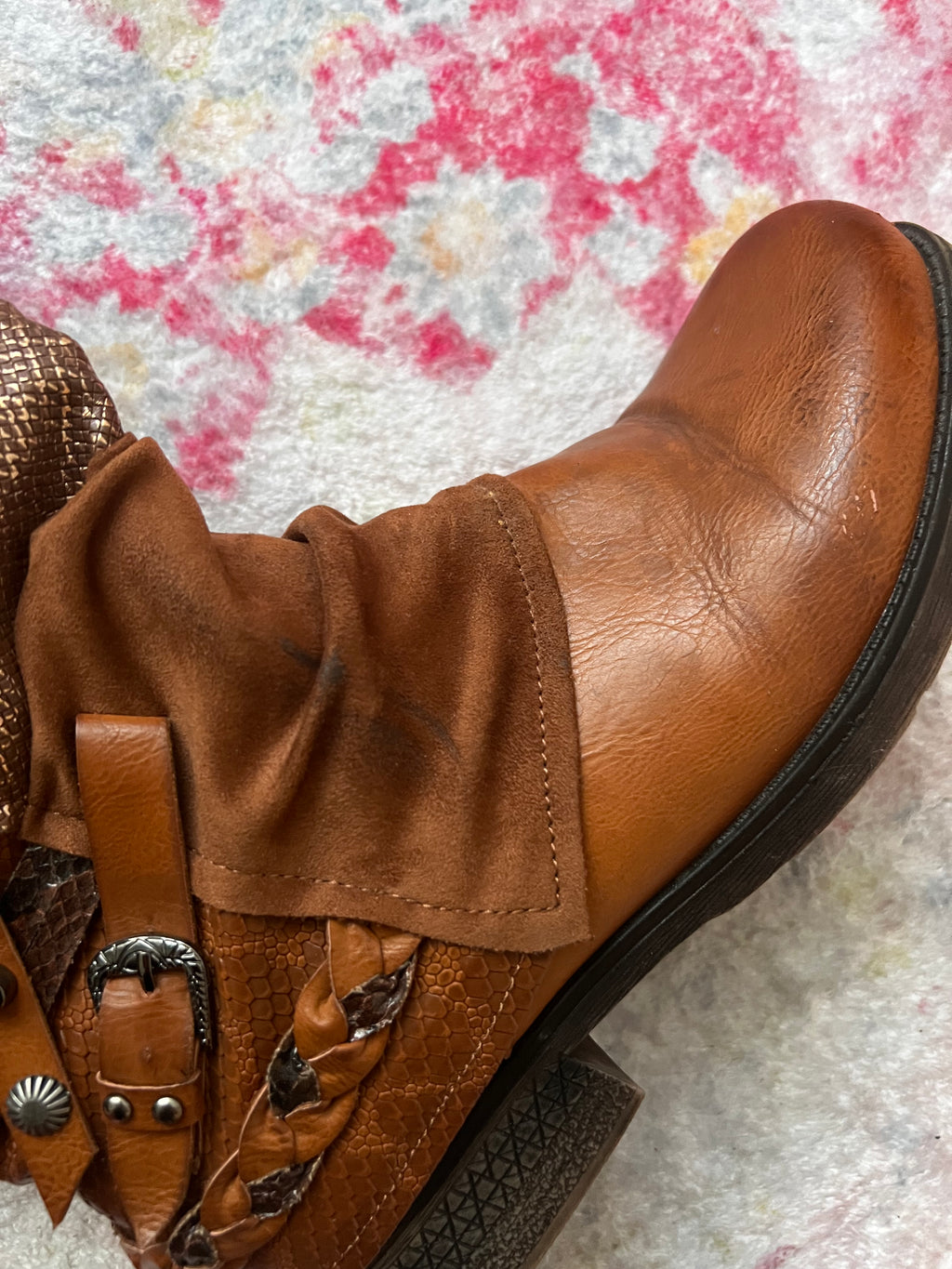 Brown boots with snake skin pattern