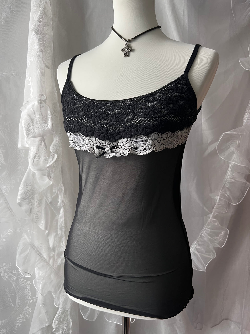 Black lace cami top with white lace trim and bow detail