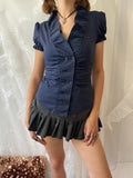 Navy blue button up blouse with ruffle details