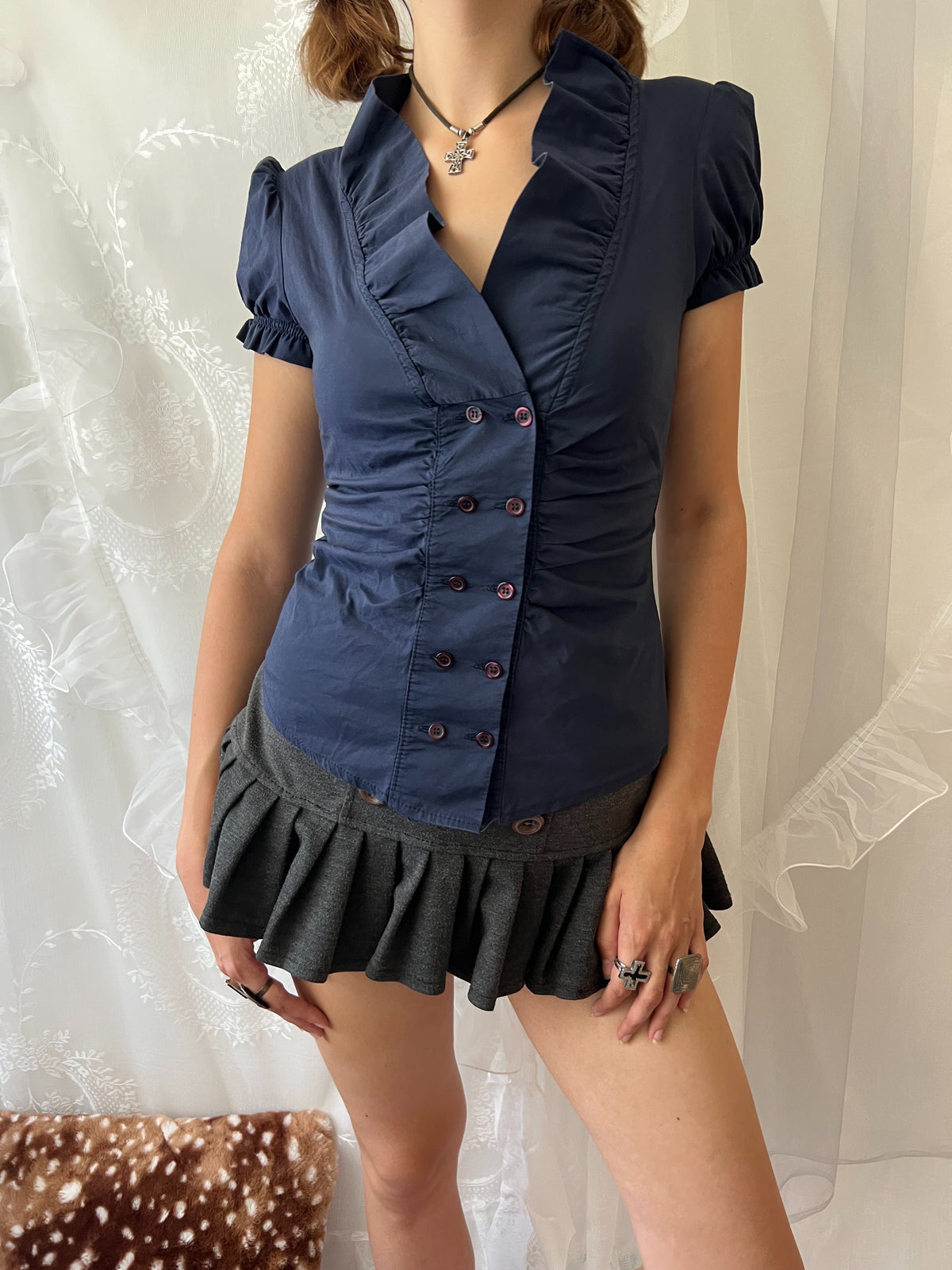 Navy blue button up blouse with ruffle details