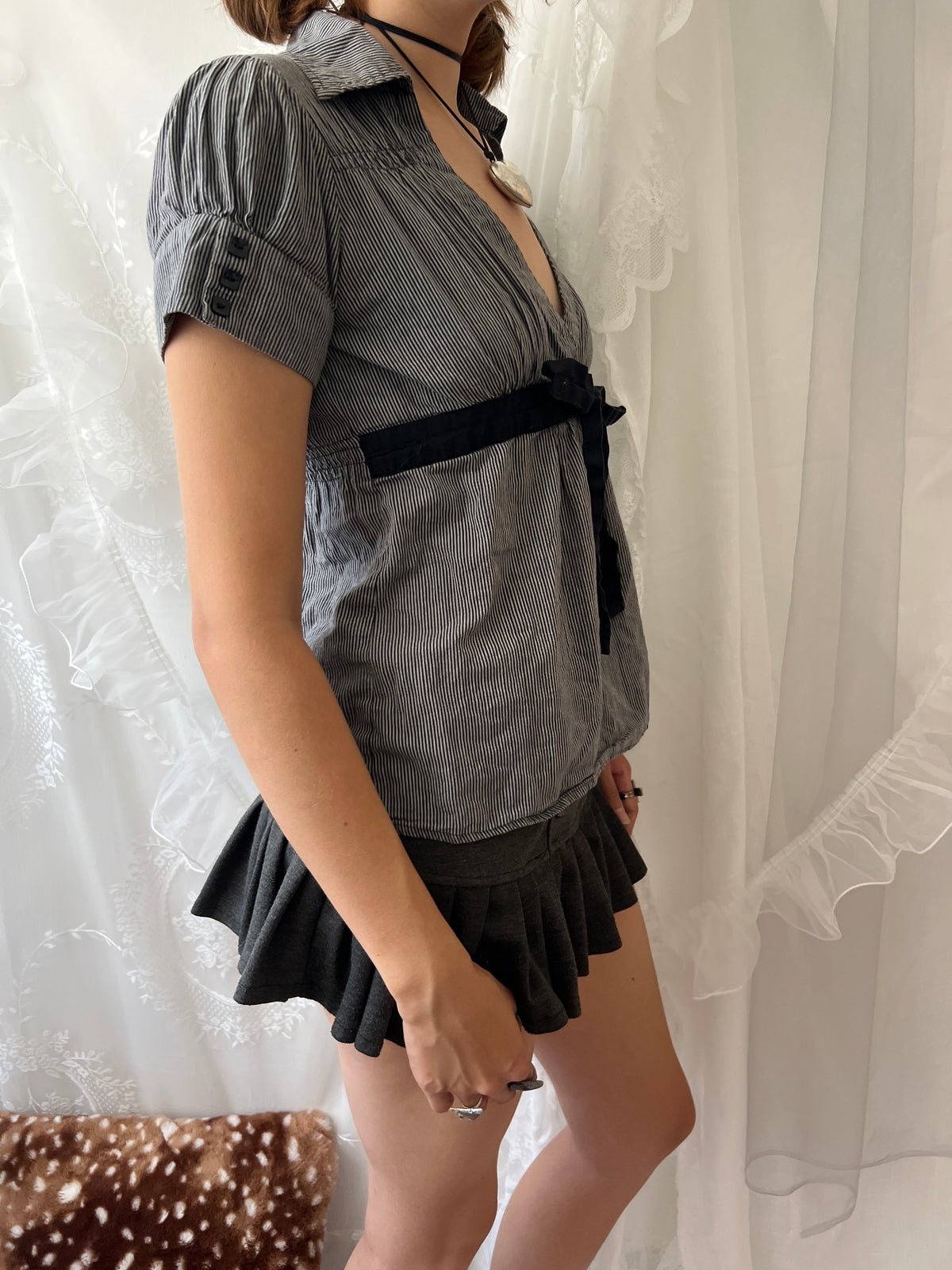 Grey pinstriped belted blouse with black ribbon tie