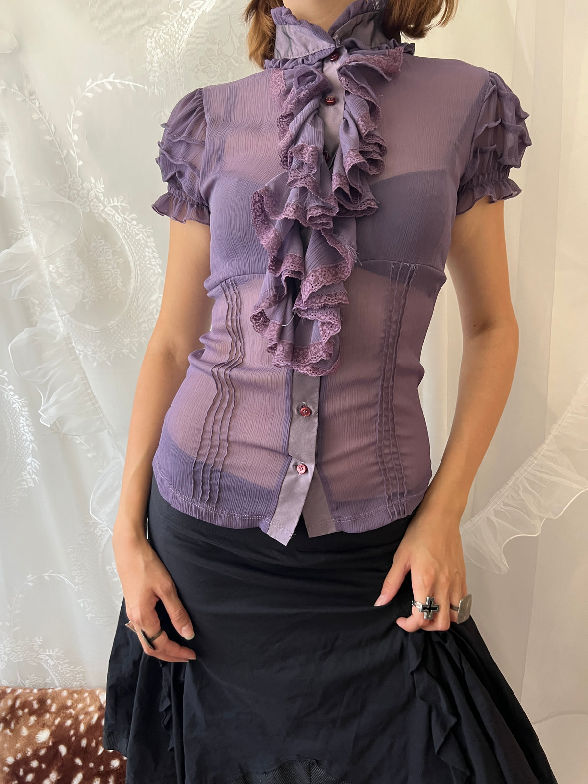 Purple sheer blouse with ruffles and lace details