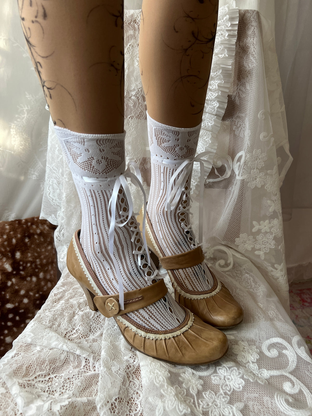 Tan Mary Jane heels with white lace trim and button detail