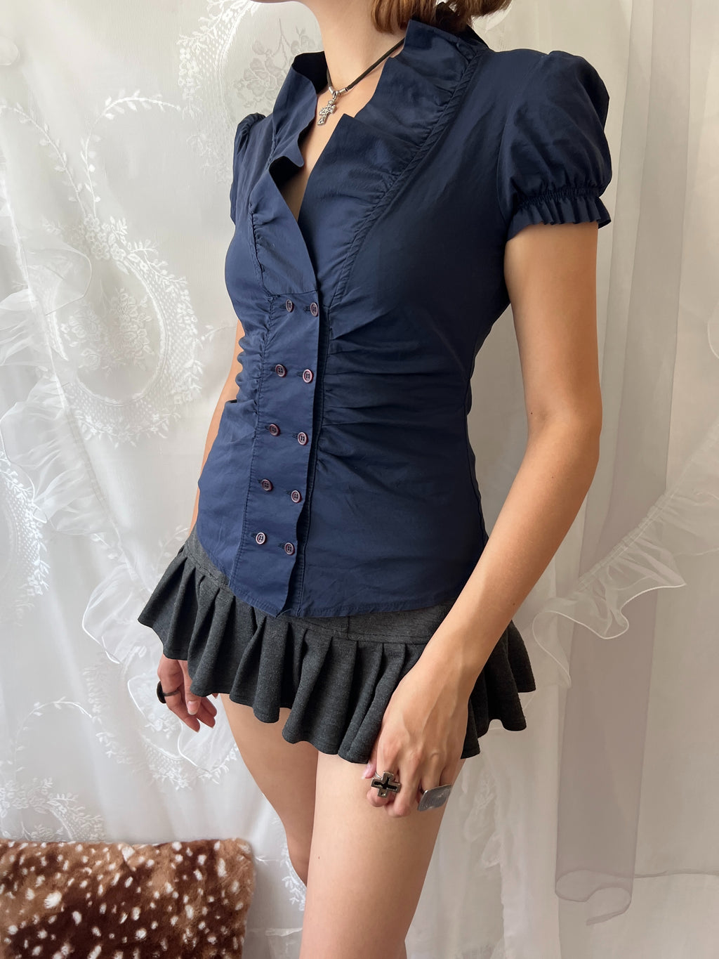 Navy blue button up blouse with ruffle details