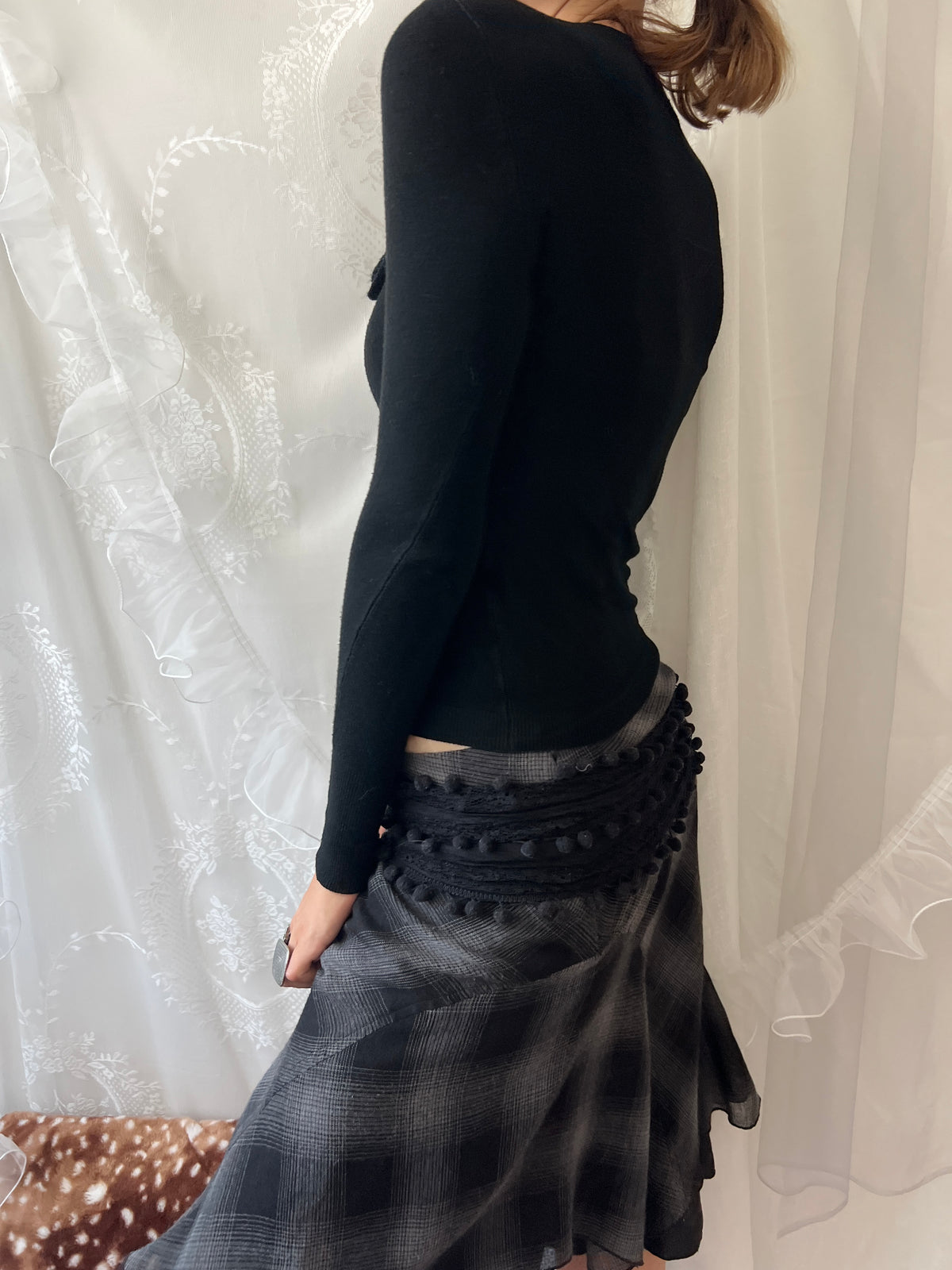 Black long sleeve top with button up front and flower detail