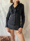 Black ruffle blouse with button up front and long sleeves