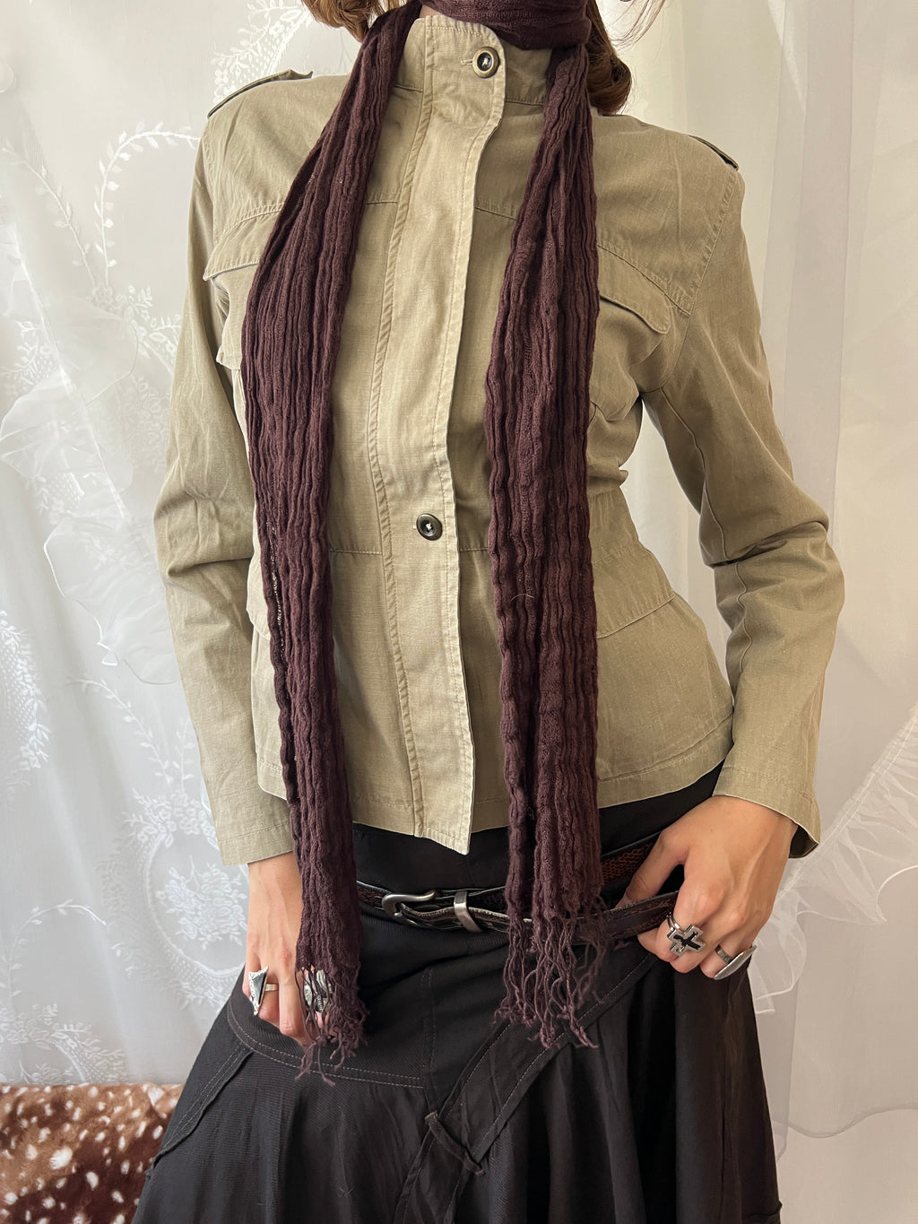 Khaki beige jacket with pockets, a zipper and a button-up front