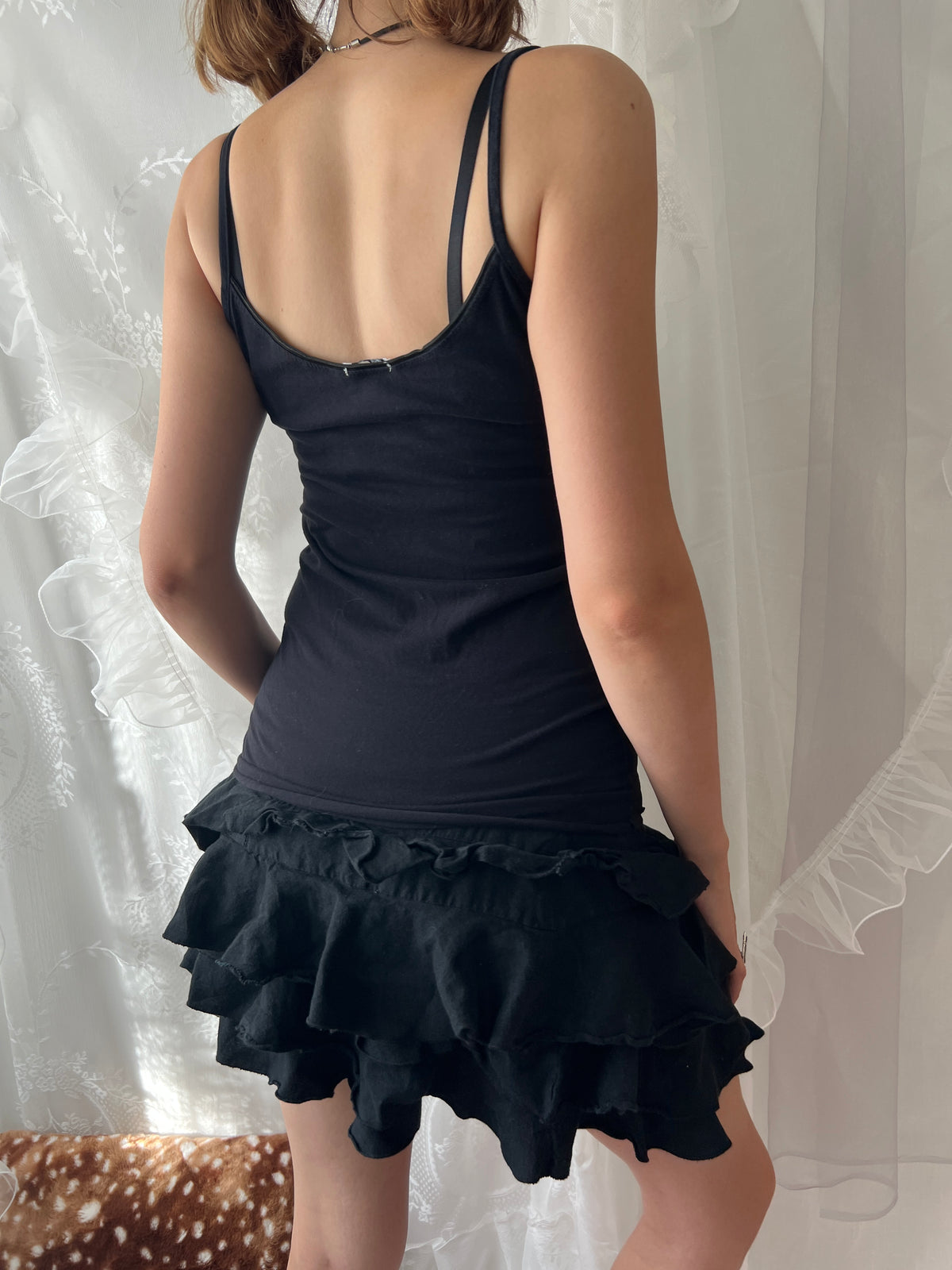 Black lace cami top with white lace trim and bow detail
