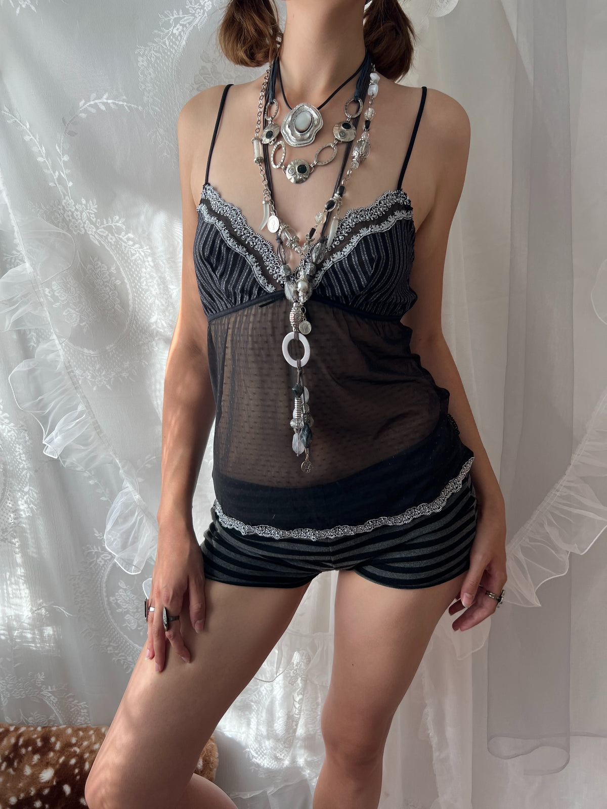Black lace cami top with sheer mesh overlay and adjustable straps