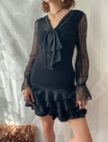 Black sheer polka dot blouse with bow detail