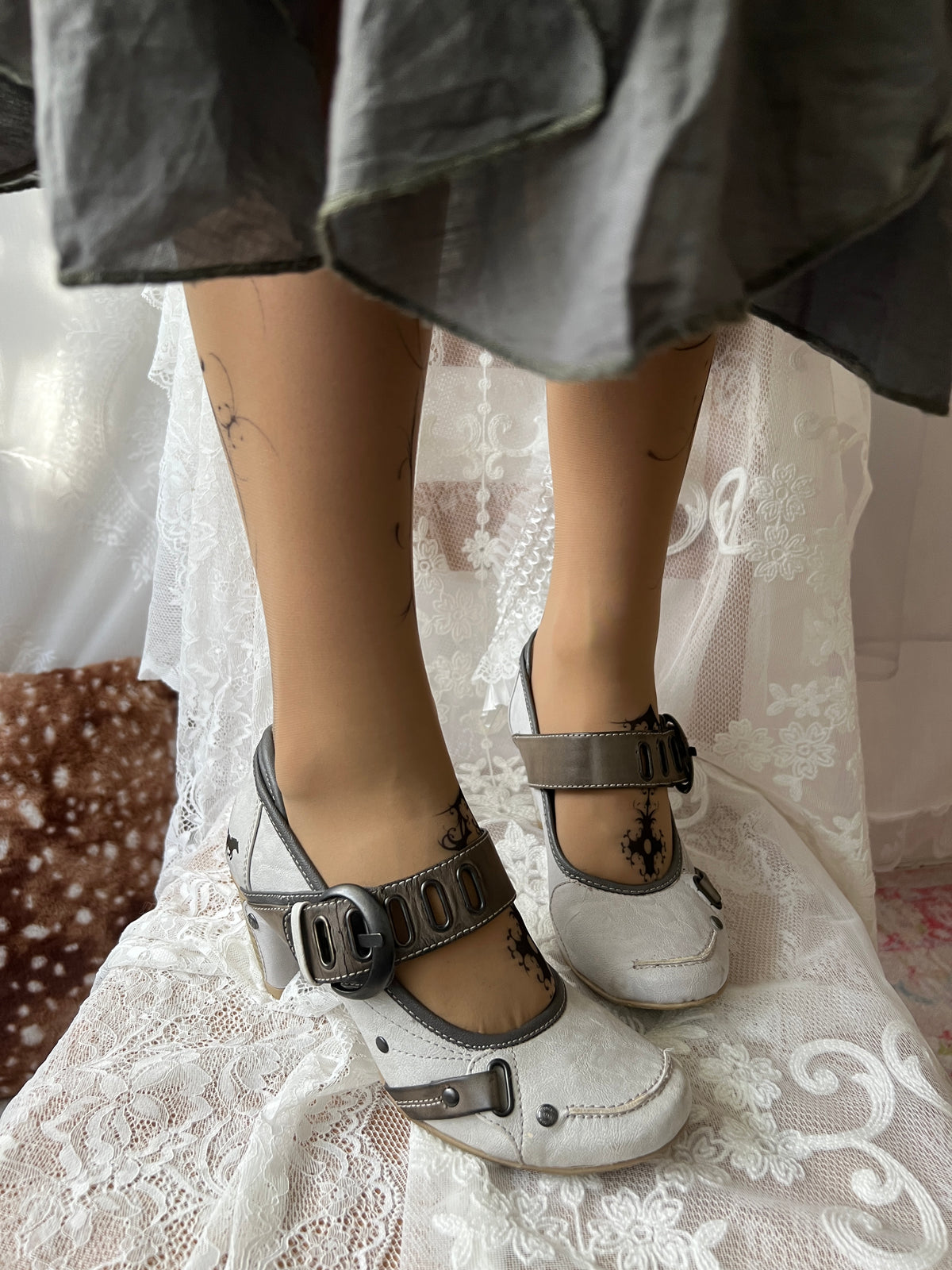 White Mustang heels with gray straps and buckles