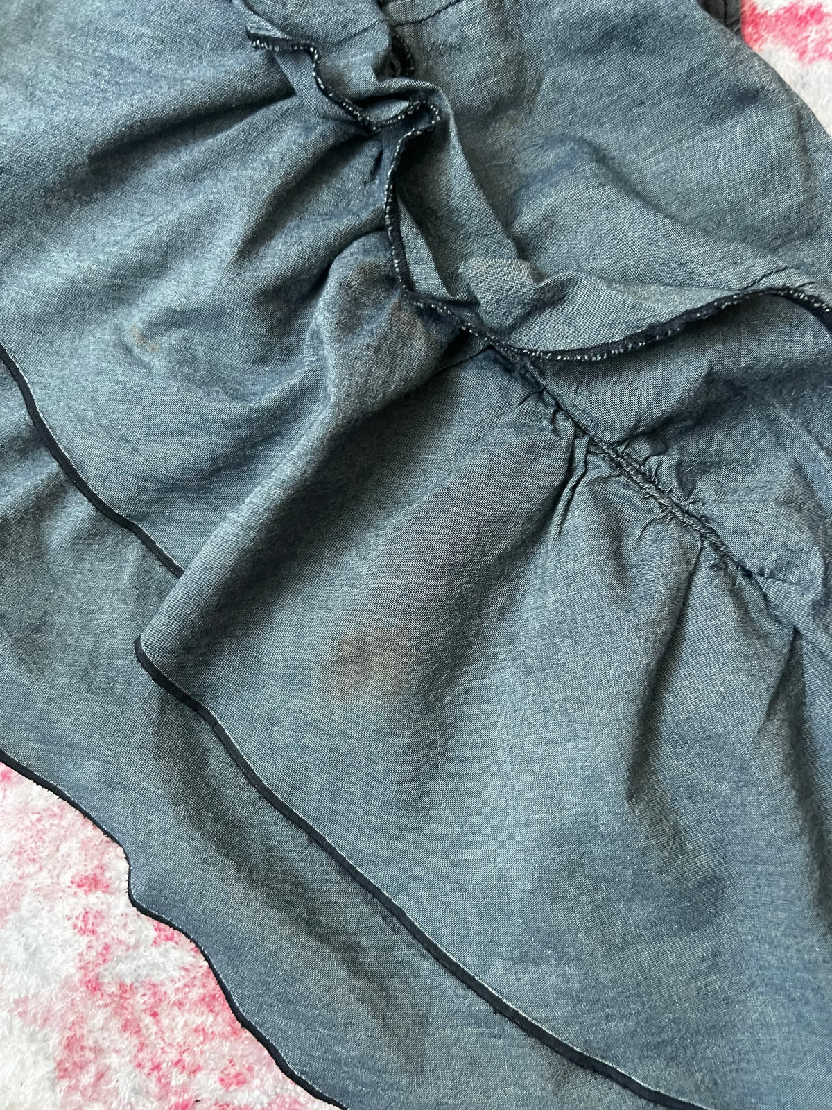 Blue ruffle layered mini skirt with buttons on both sides