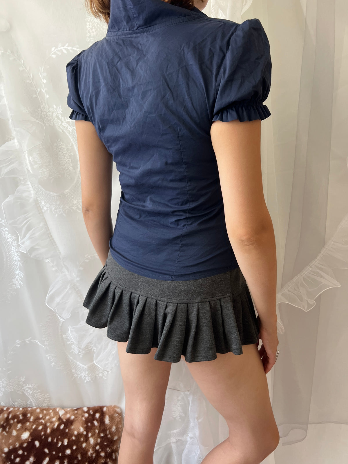Navy blue button up blouse with ruffle details