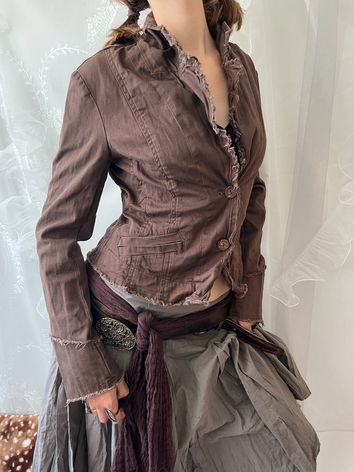 Brown cropped jacket with frayed hem and button details