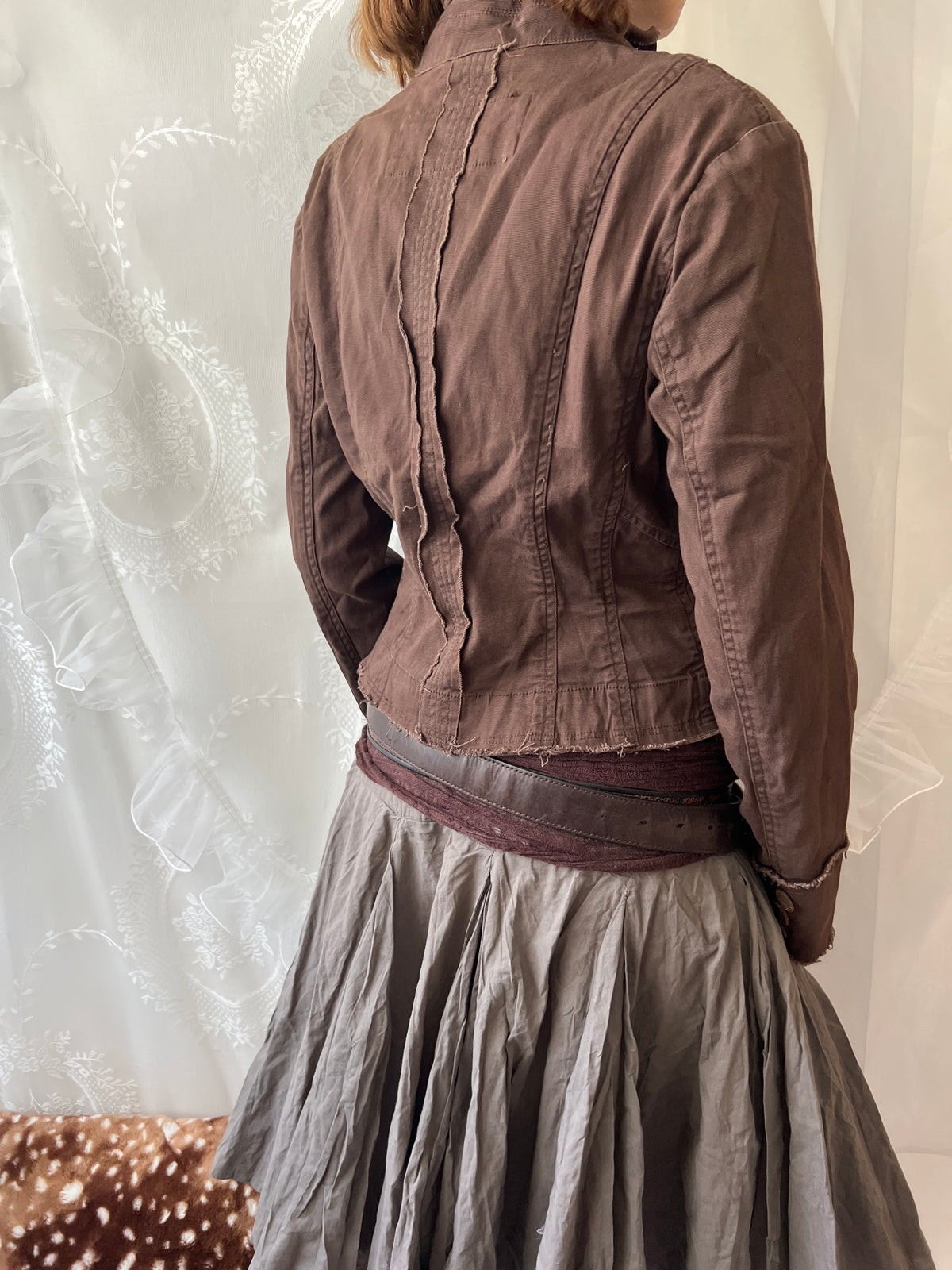 Brown cropped jacket with frayed hem and button details