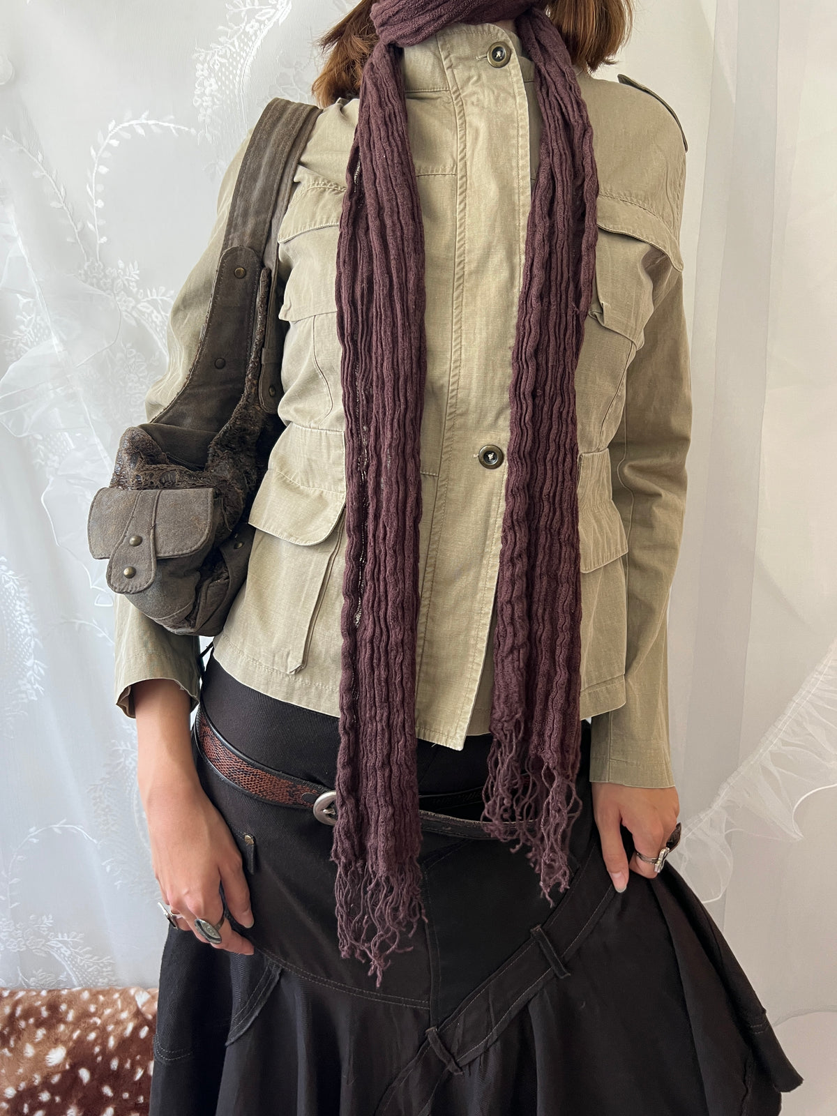 Khaki beige jacket with pockets, a zipper and a button-up front