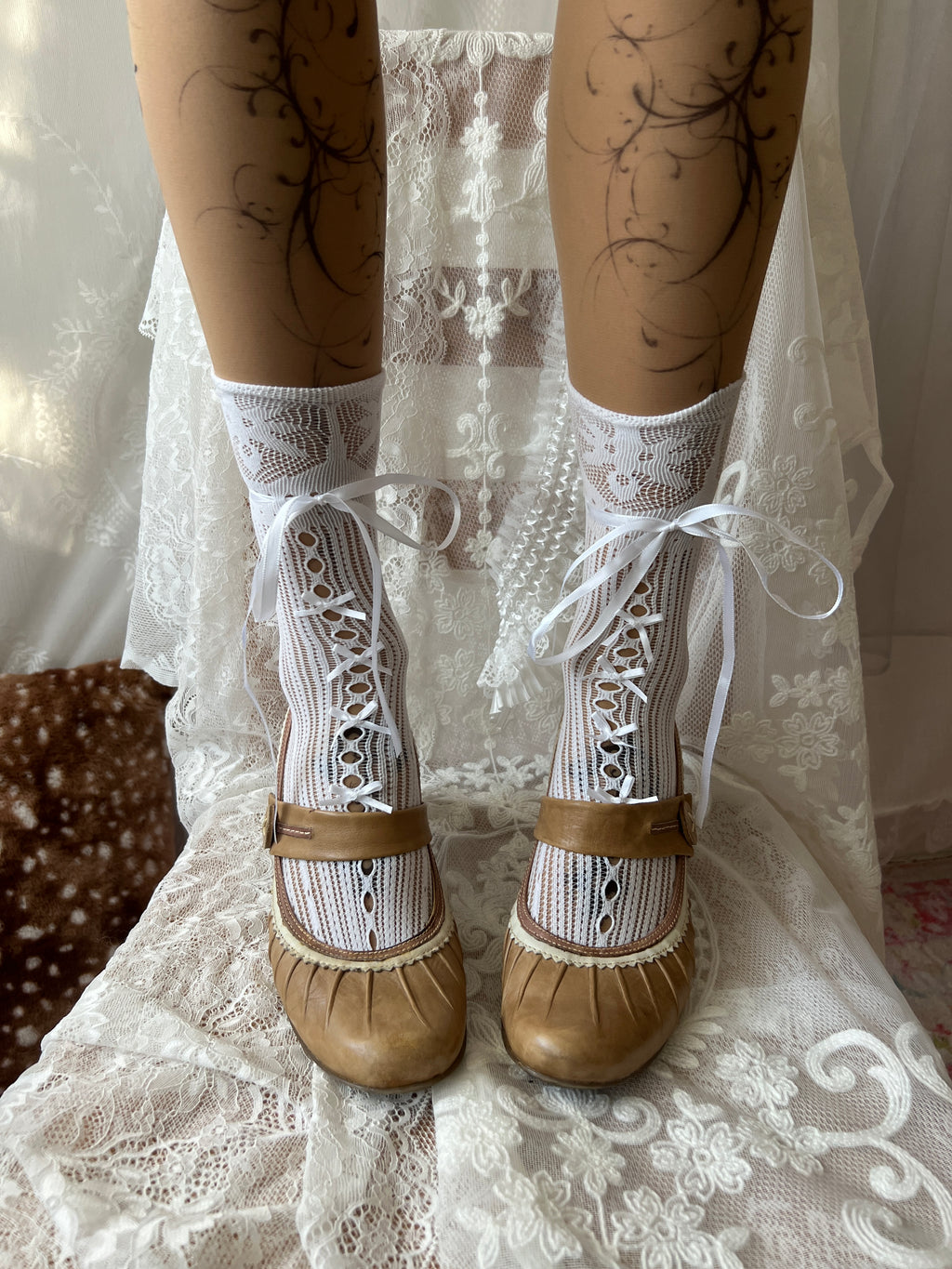 Tan Mary Jane heels with white lace trim and button detail