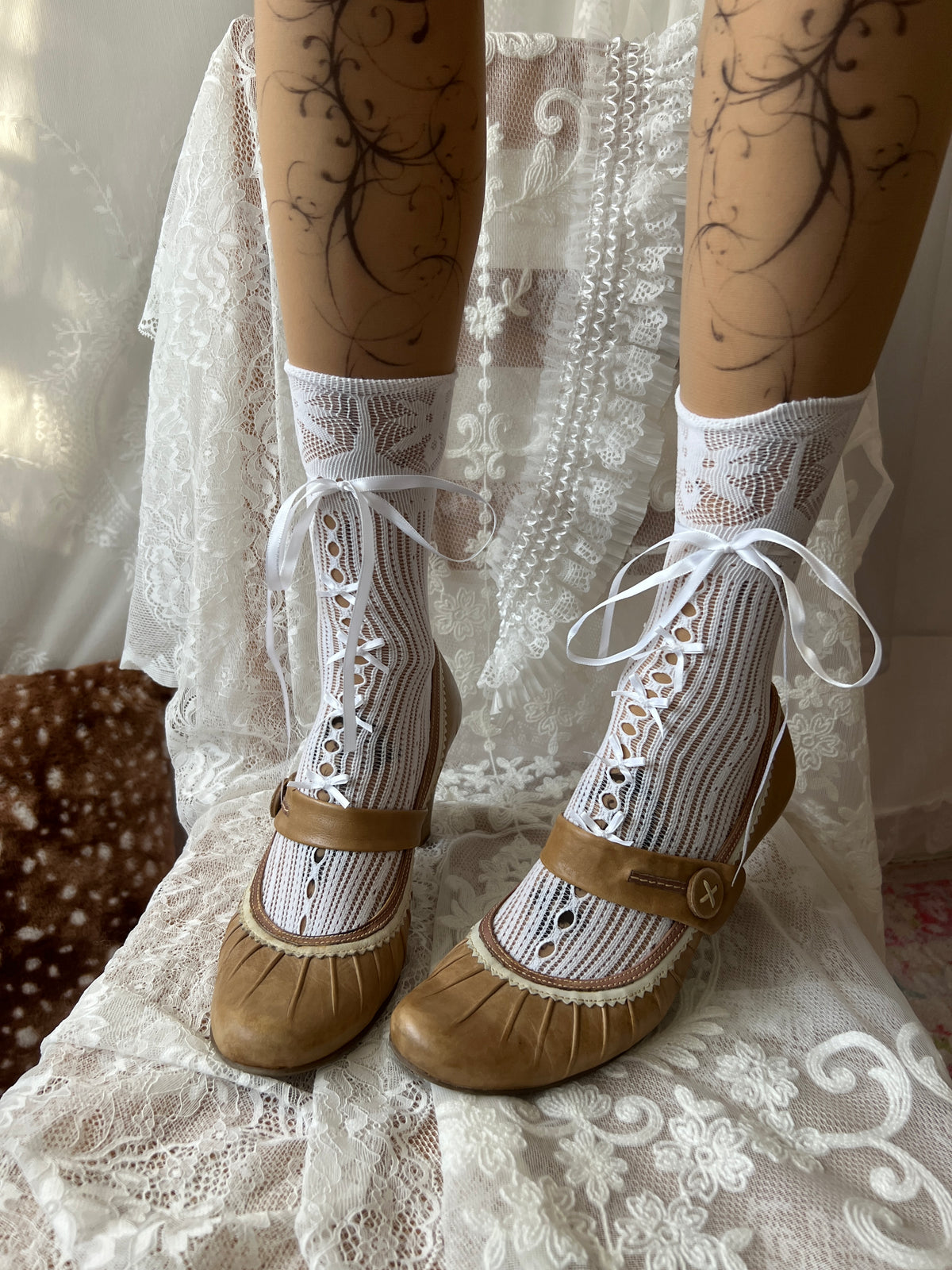 Tan Mary Jane heels with white lace trim and button detail