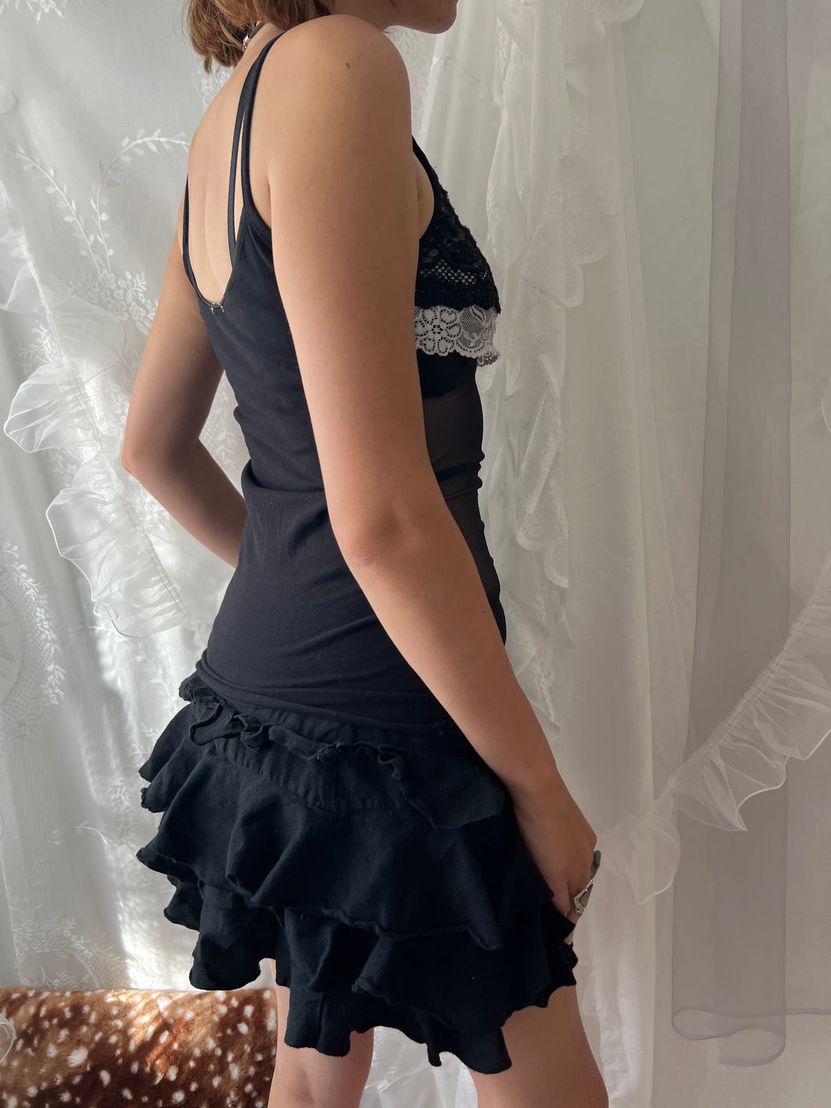 Black lace cami top with white lace trim and bow detail