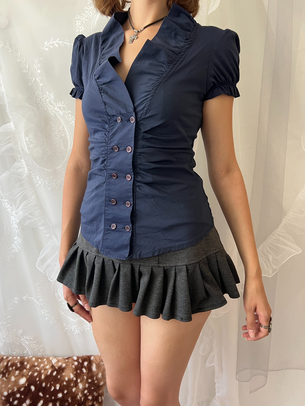 Navy blue button up blouse with ruffle details