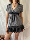 Grey pinstriped belted blouse with black ribbon tie
