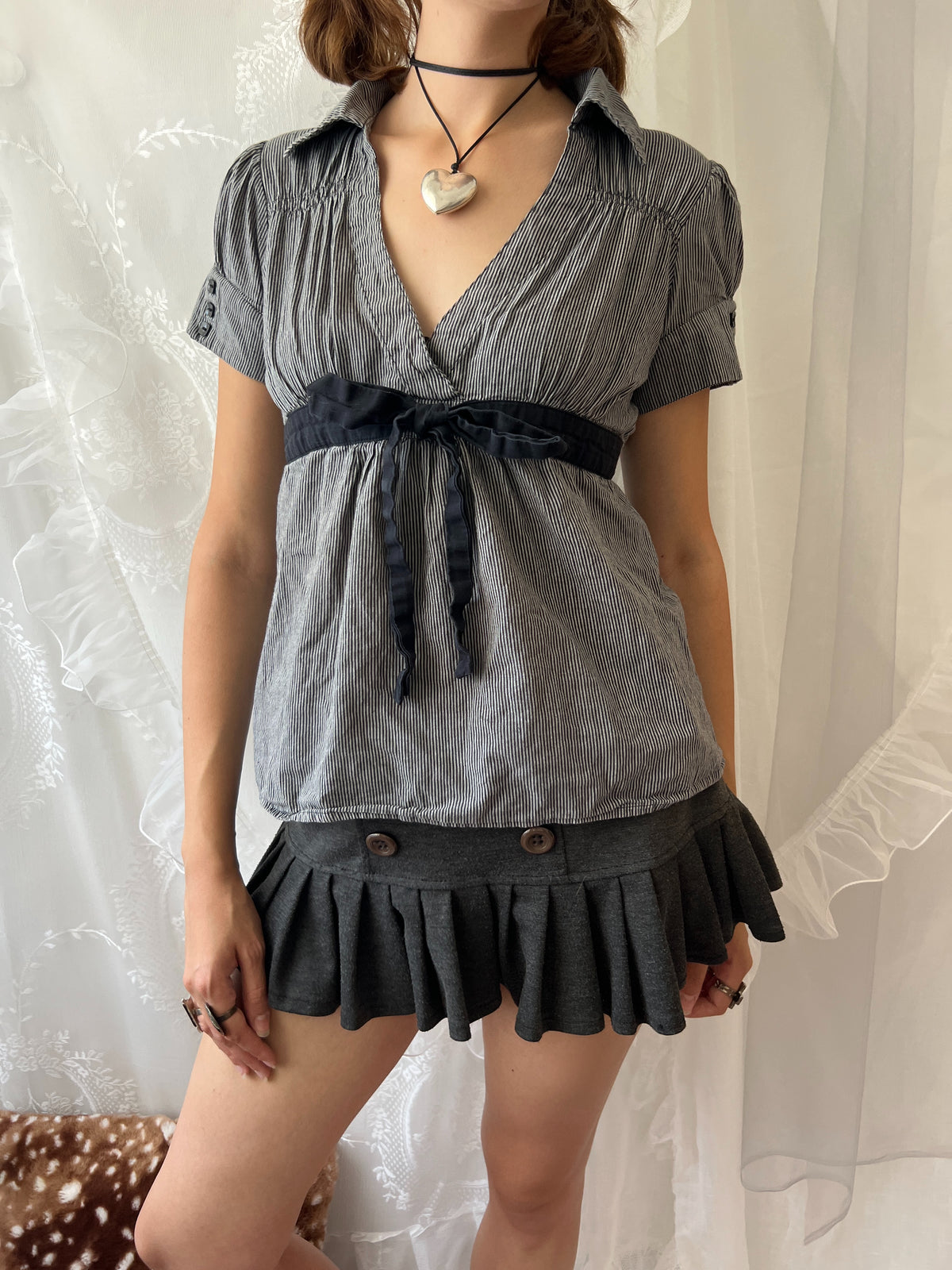 Grey pinstriped belted blouse with black ribbon tie