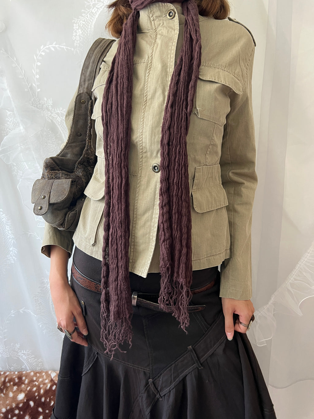 Khaki beige jacket with pockets, a zipper and a button-up front