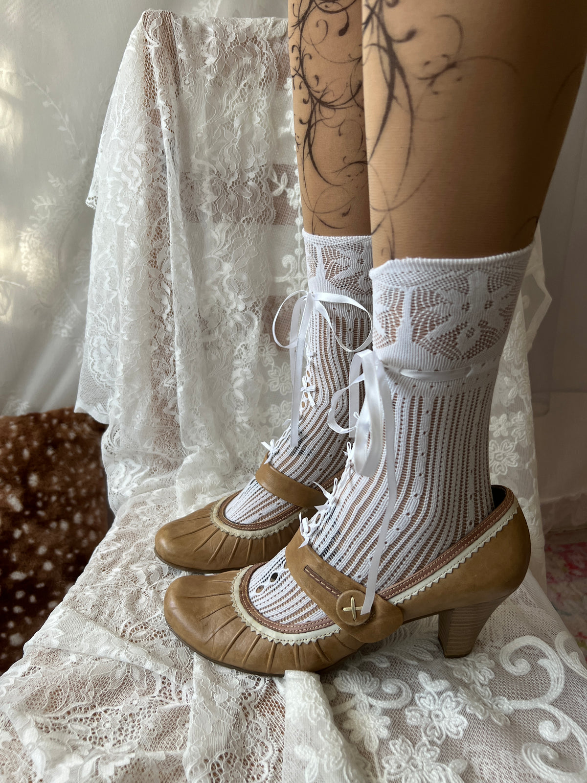 Tan Mary Jane heels with white lace trim and button detail