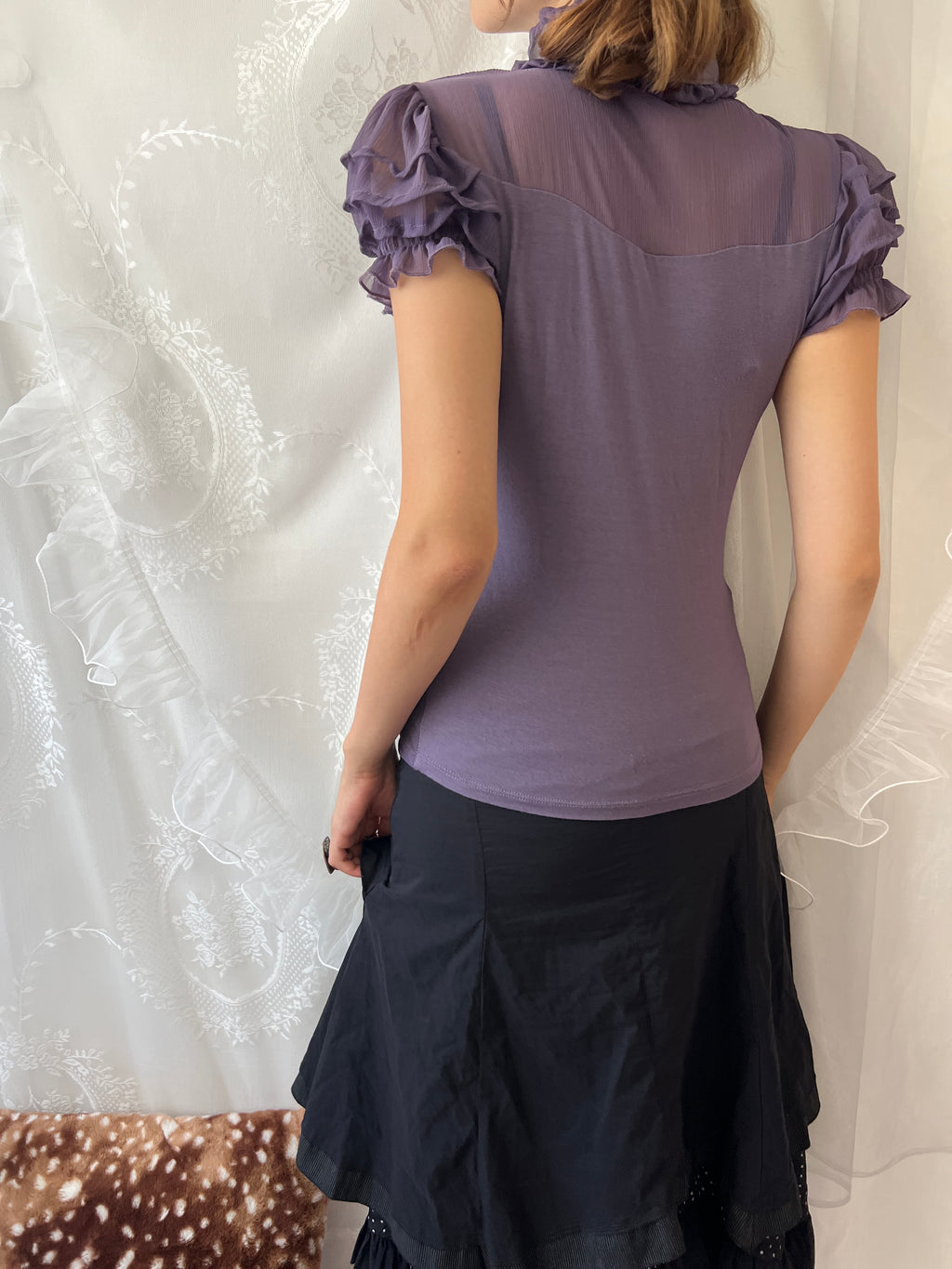 Purple sheer blouse with ruffles and lace details